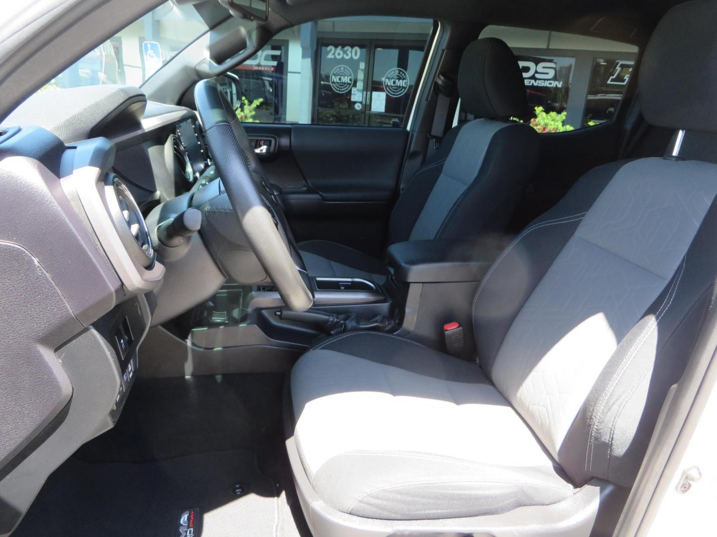 2021 White Toyota Tacoma SR5 Double Cab V6 6AT 4WD (3TMCZ5AN1MM) with an 3.5L V6 DOHC 24V engine, 6A transmission, located at 2630 Grass Valley Highway, Auburn, CA, 95603, (530) 508-5100, 38.937893, -121.095482 - Icon Vehicle Dynamics remote reservoir coilovers & shocks, Icon Upper control arms, 1552 wheels, Toyo AT3 tires, Rock Sliders, Victory 4x4 roof and camper shell rack, Leer Camper shell, Banks Idash. - Photo#39