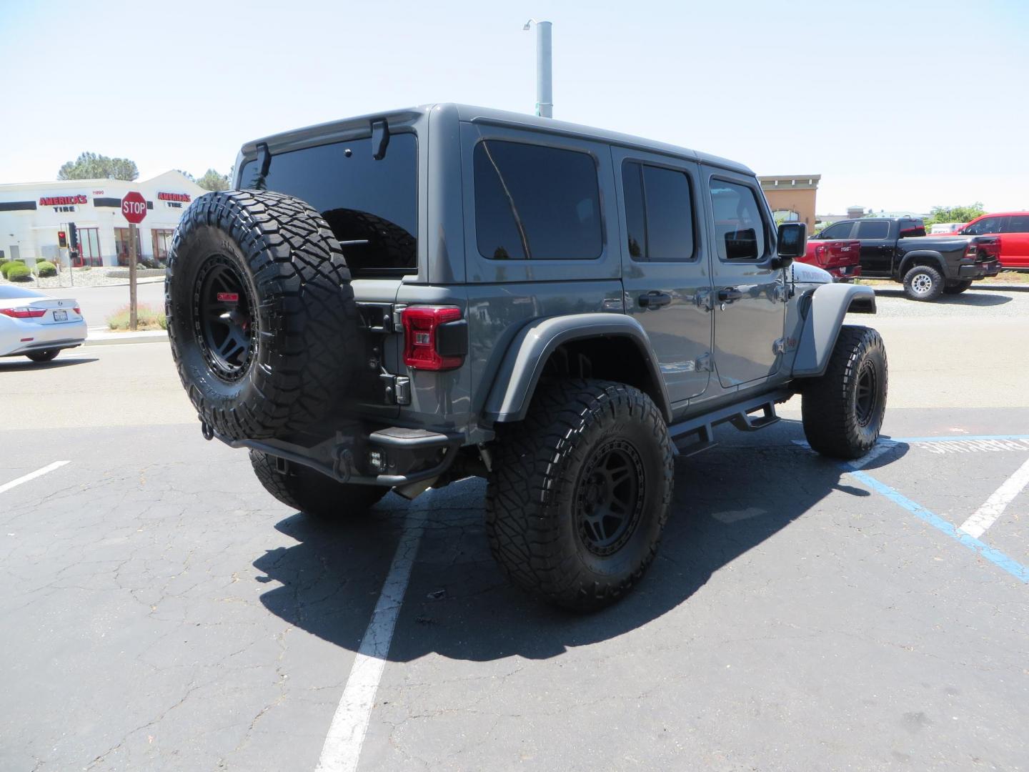 2023 Gray /Black Jeep Wrangler Unlimited Rubicon (1C4HJXFG8PW) with an 3.6L V6 DOHC 24V FFV engine, 6A transmission, located at 2630 Grass Valley Highway, Auburn, CA, 95603, (530) 508-5100, 38.937893, -121.095482 - Features a 3.5" JKS suspension system, Fox shocks, 17" Method Race wheels, 37" Nitto Ridge Grappler tires, N-Fab EPYX running boards, Teraflex HD tire carrier, RC front & rear bumpers with led lights, and window tint. - Photo#4