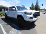 2021 White Toyota Tacoma SR5 Double Cab V6 6AT 4WD (3TYCZ5AN8MT) with an 3.5L V6 DOHC 24V engine, 6A transmission, located at 2630 Grass Valley Highway, Auburn, CA, 95603, (530) 508-5100, 38.937893, -121.095482 - Leveled Tacoma sitting on 18" Fuel wheels, Toyo RT tires, Bakflip bed cover, and window tint. - Photo#2