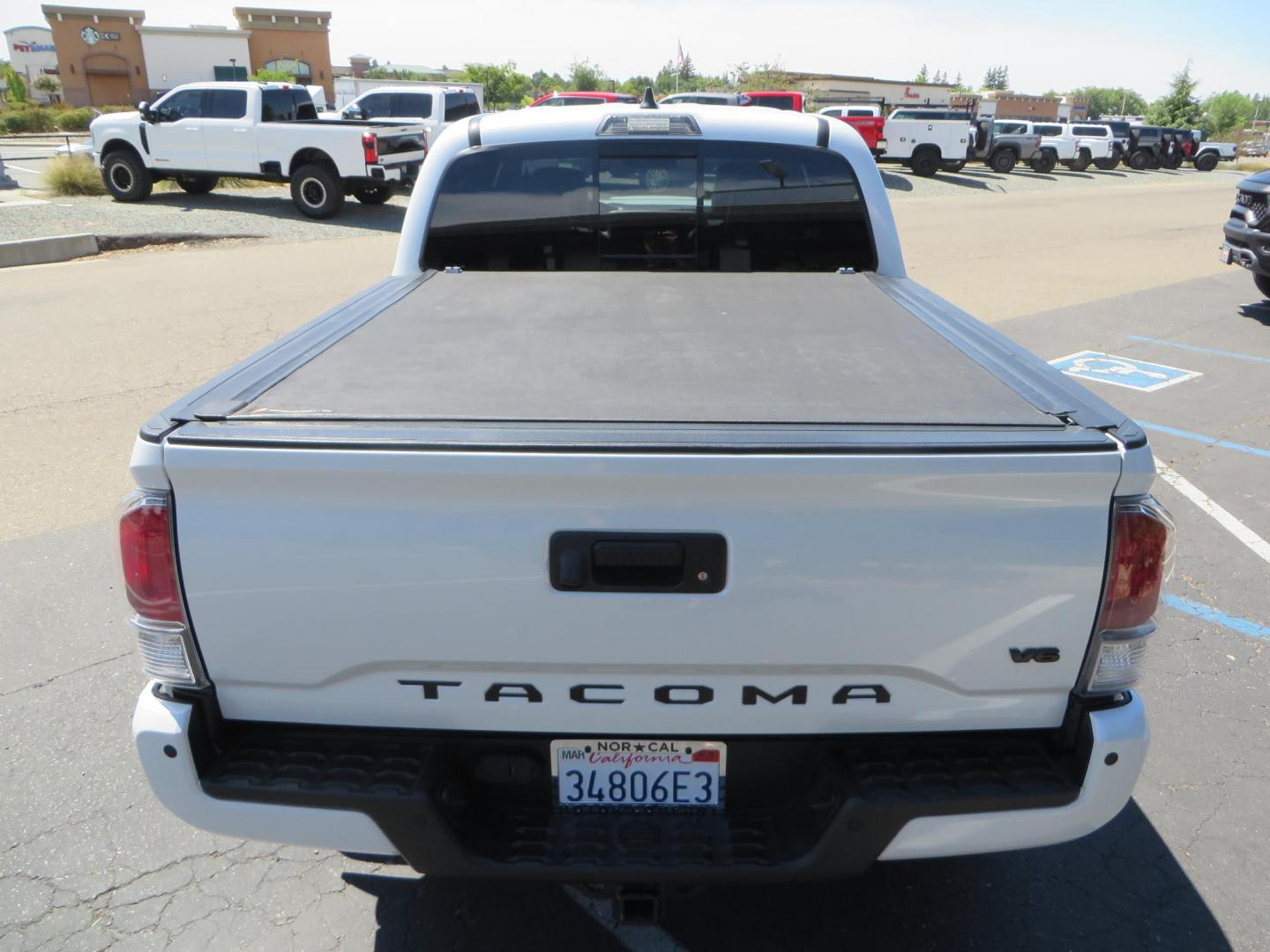 2021 White Toyota Tacoma SR5 Double Cab V6 6AT 4WD (3TYCZ5AN8MT) with an 3.5L V6 DOHC 24V engine, 6A transmission, located at 2630 Grass Valley Highway, Auburn, CA, 95603, (530) 508-5100, 38.937893, -121.095482 - Leveled Tacoma sitting on 18" Fuel wheels, Toyo RT tires, Bakflip bed cover, and window tint. - Photo#9