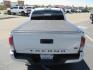2021 White Toyota Tacoma SR5 Double Cab V6 6AT 4WD (3TYCZ5AN8MT) with an 3.5L V6 DOHC 24V engine, 6A transmission, located at 2630 Grass Valley Highway, Auburn, CA, 95603, (530) 508-5100, 38.937893, -121.095482 - Leveled Tacoma sitting on 18" Fuel wheels, Toyo RT tires, Bakflip bed cover, and window tint. - Photo#9