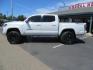 2021 White Toyota Tacoma SR5 Double Cab V6 6AT 4WD (3TYCZ5AN8MT) with an 3.5L V6 DOHC 24V engine, 6A transmission, located at 2630 Grass Valley Highway, Auburn, CA, 95603, (530) 508-5100, 38.937893, -121.095482 - Leveled Tacoma sitting on 18" Fuel wheels, Toyo RT tires, Bakflip bed cover, and window tint. - Photo#7