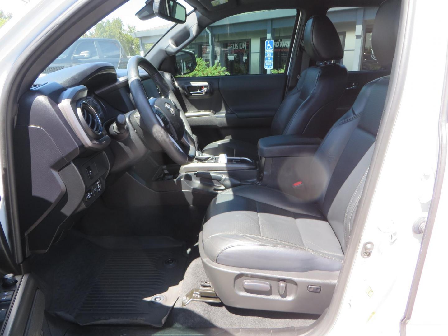 2021 White Toyota Tacoma SR5 Double Cab V6 6AT 4WD (3TYCZ5AN8MT) with an 3.5L V6 DOHC 24V engine, 6A transmission, located at 2630 Grass Valley Highway, Auburn, CA, 95603, (530) 508-5100, 38.937893, -121.095482 - Leveled Tacoma sitting on 18" Fuel wheels, Toyo RT tires, Bakflip bed cover, and window tint. - Photo#17