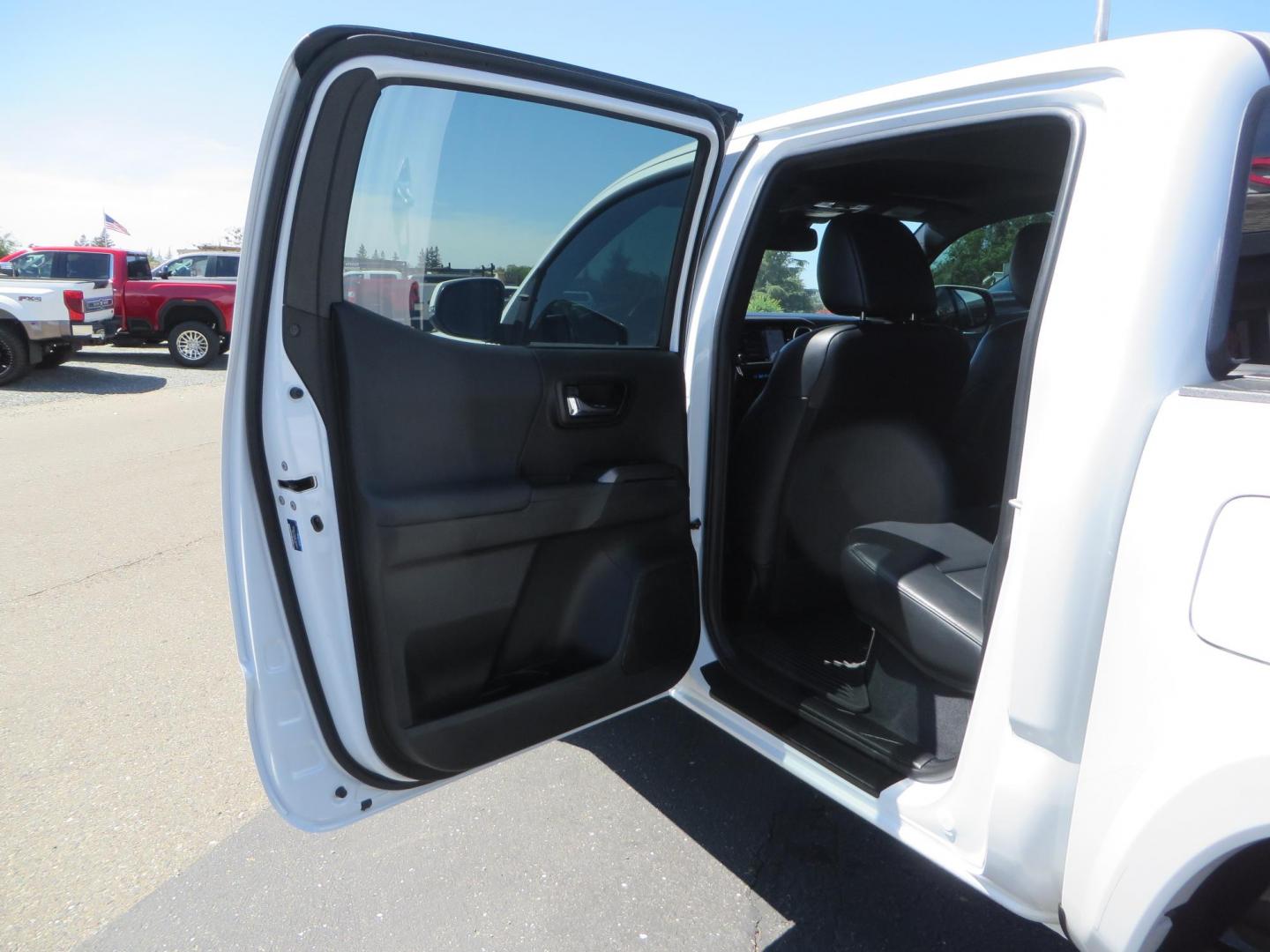 2021 White Toyota Tacoma SR5 Double Cab V6 6AT 4WD (3TYCZ5AN8MT) with an 3.5L V6 DOHC 24V engine, 6A transmission, located at 2630 Grass Valley Highway, Auburn, CA, 95603, (530) 508-5100, 38.937893, -121.095482 - Leveled Tacoma sitting on 18" Fuel wheels, Toyo RT tires, Bakflip bed cover, and window tint. - Photo#34