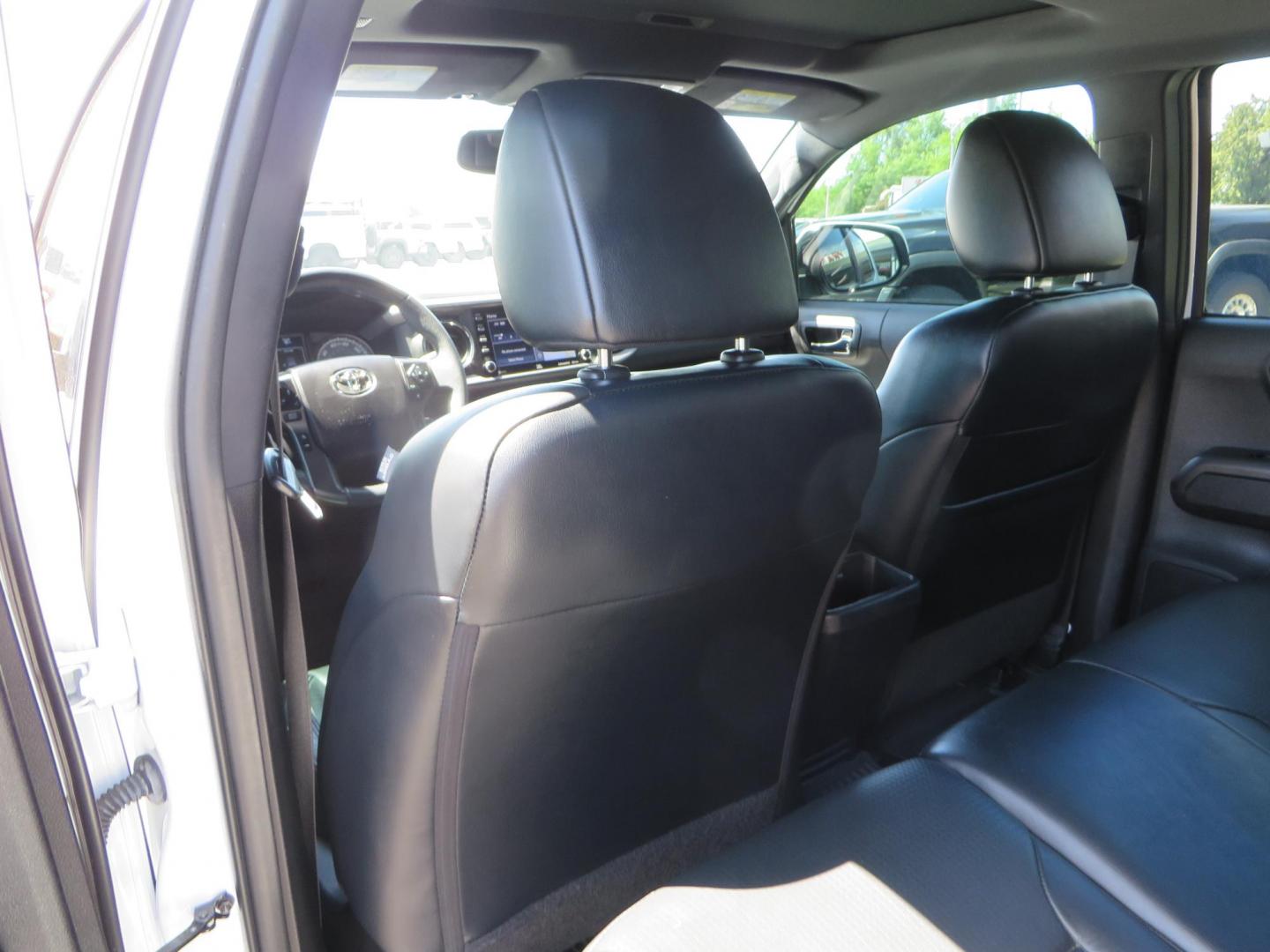 2021 White Toyota Tacoma SR5 Double Cab V6 6AT 4WD (3TYCZ5AN8MT) with an 3.5L V6 DOHC 24V engine, 6A transmission, located at 2630 Grass Valley Highway, Auburn, CA, 95603, (530) 508-5100, 38.937893, -121.095482 - Leveled Tacoma sitting on 18" Fuel wheels, Toyo RT tires, Bakflip bed cover, and window tint. - Photo#39