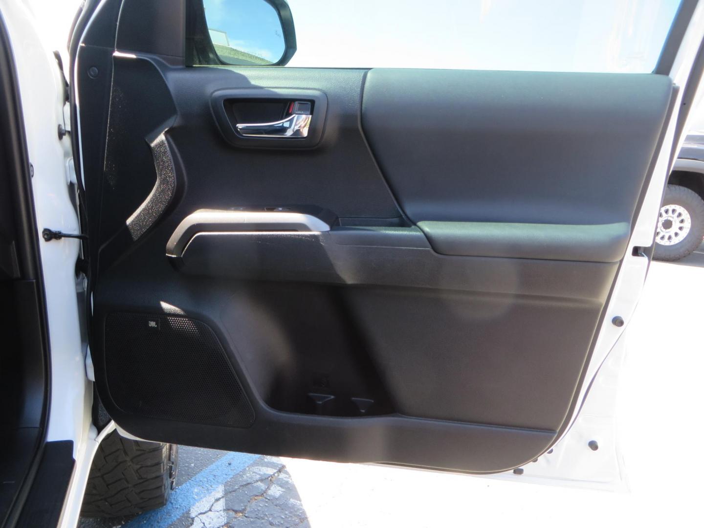 2021 White Toyota Tacoma SR5 Double Cab V6 6AT 4WD (3TYCZ5AN8MT) with an 3.5L V6 DOHC 24V engine, 6A transmission, located at 2630 Grass Valley Highway, Auburn, CA, 95603, (530) 508-5100, 38.937893, -121.095482 - Leveled Tacoma sitting on 18" Fuel wheels, Toyo RT tires, Bakflip bed cover, and window tint. - Photo#41