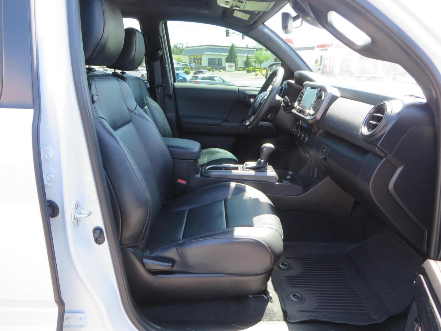 2021 White Toyota Tacoma SR5 Double Cab V6 6AT 4WD (3TYCZ5AN8MT) with an 3.5L V6 DOHC 24V engine, 6A transmission, located at 2630 Grass Valley Highway, Auburn, CA, 95603, (530) 508-5100, 38.937893, -121.095482 - Leveled Tacoma sitting on 18" Fuel wheels, Toyo RT tires, Bakflip bed cover, and window tint. - Photo#44