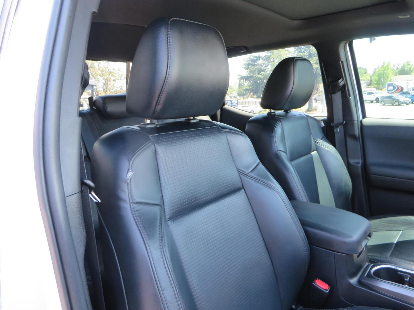2021 White Toyota Tacoma SR5 Double Cab V6 6AT 4WD (3TYCZ5AN8MT) with an 3.5L V6 DOHC 24V engine, 6A transmission, located at 2630 Grass Valley Highway, Auburn, CA, 95603, (530) 508-5100, 38.937893, -121.095482 - Leveled Tacoma sitting on 18" Fuel wheels, Toyo RT tires, Bakflip bed cover, and window tint. - Photo#45