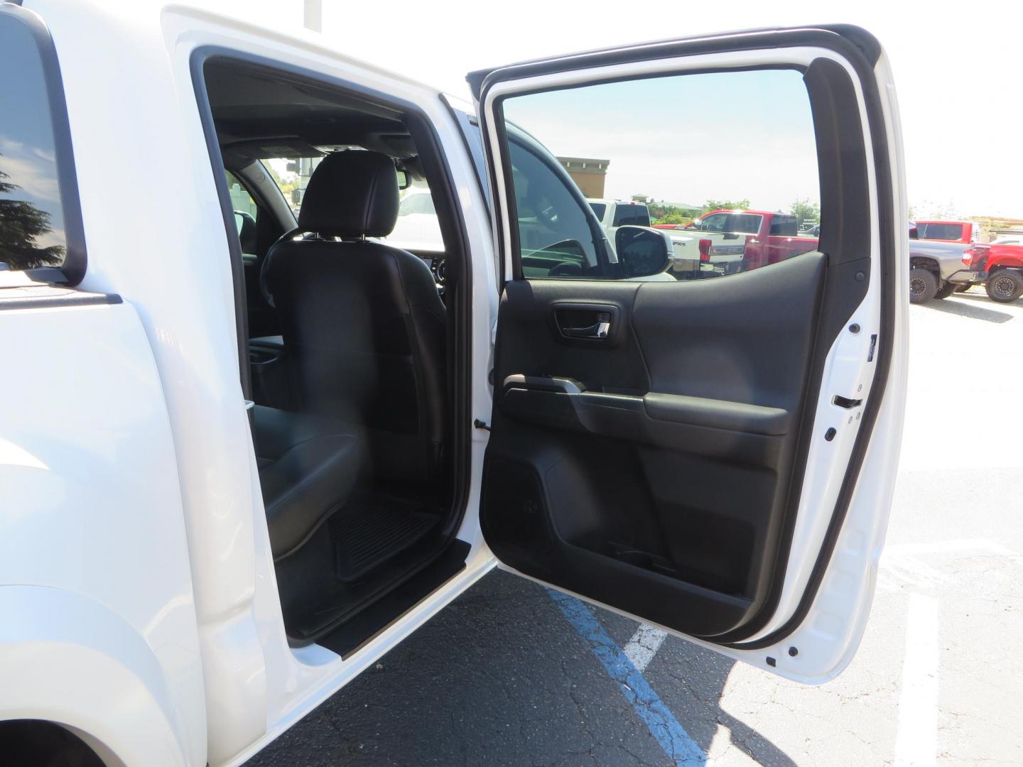 2021 White Toyota Tacoma SR5 Double Cab V6 6AT 4WD (3TYCZ5AN8MT) with an 3.5L V6 DOHC 24V engine, 6A transmission, located at 2630 Grass Valley Highway, Auburn, CA, 95603, (530) 508-5100, 38.937893, -121.095482 - Leveled Tacoma sitting on 18" Fuel wheels, Toyo RT tires, Bakflip bed cover, and window tint. - Photo#48