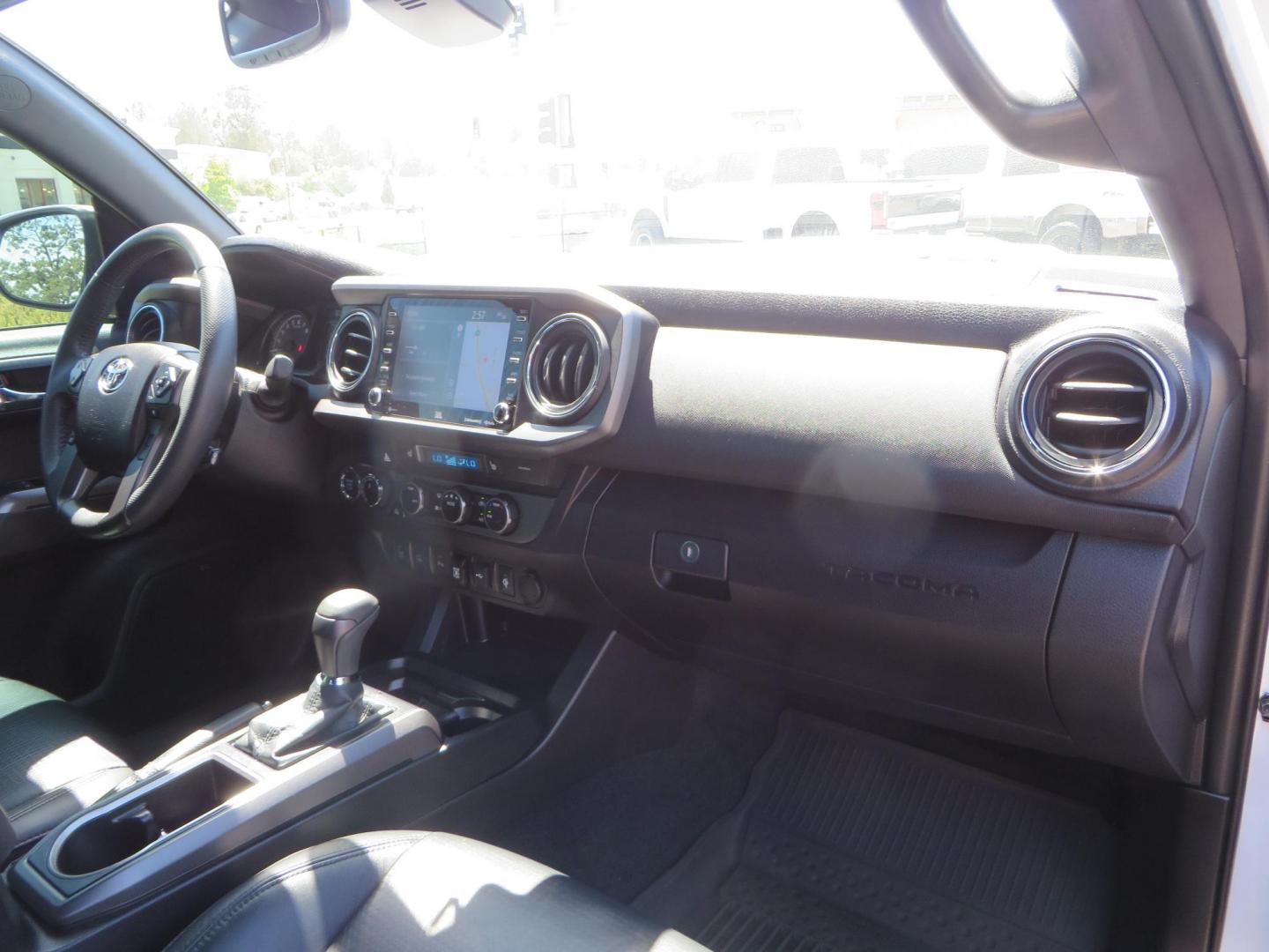 2021 White Toyota Tacoma SR5 Double Cab V6 6AT 4WD (3TYCZ5AN8MT) with an 3.5L V6 DOHC 24V engine, 6A transmission, located at 2630 Grass Valley Highway, Auburn, CA, 95603, (530) 508-5100, 38.937893, -121.095482 - Leveled Tacoma sitting on 18" Fuel wheels, Toyo RT tires, Bakflip bed cover, and window tint. - Photo#47