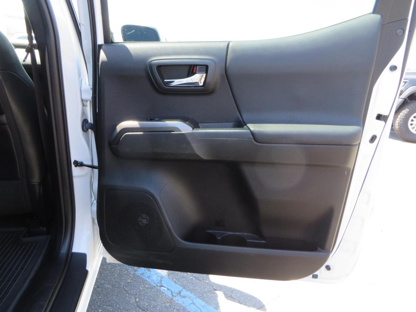 2021 White Toyota Tacoma SR5 Double Cab V6 6AT 4WD (3TYCZ5AN8MT) with an 3.5L V6 DOHC 24V engine, 6A transmission, located at 2630 Grass Valley Highway, Auburn, CA, 95603, (530) 508-5100, 38.937893, -121.095482 - Leveled Tacoma sitting on 18" Fuel wheels, Toyo RT tires, Bakflip bed cover, and window tint. - Photo#49