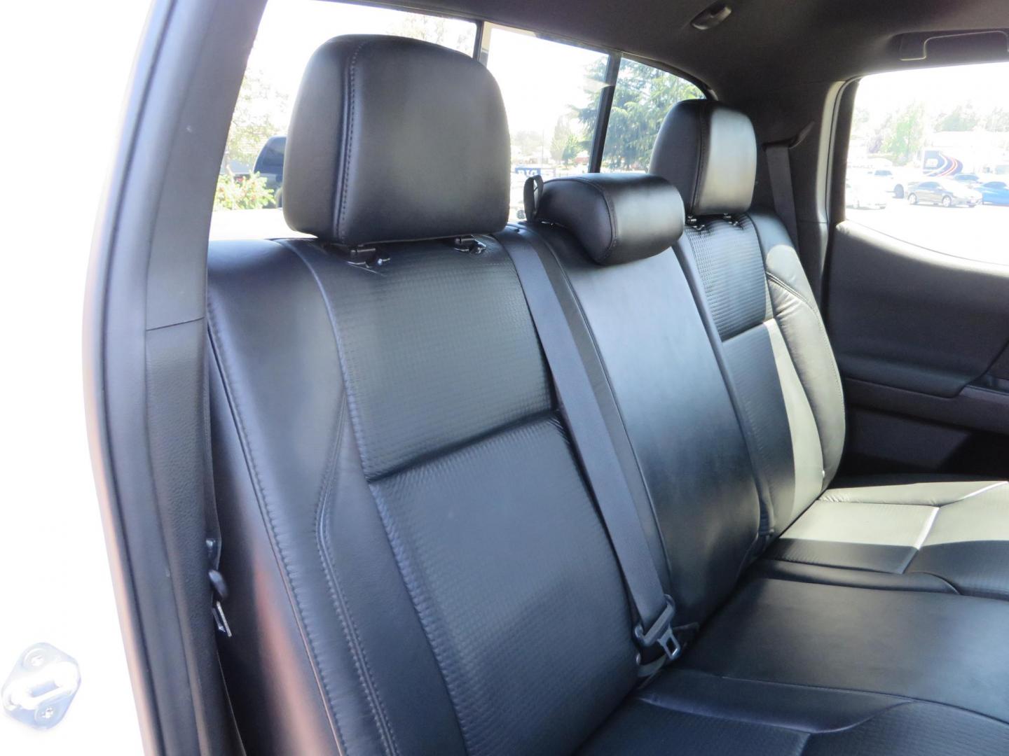 2021 White Toyota Tacoma SR5 Double Cab V6 6AT 4WD (3TYCZ5AN8MT) with an 3.5L V6 DOHC 24V engine, 6A transmission, located at 2630 Grass Valley Highway, Auburn, CA, 95603, (530) 508-5100, 38.937893, -121.095482 - Leveled Tacoma sitting on 18" Fuel wheels, Toyo RT tires, Bakflip bed cover, and window tint. - Photo#52