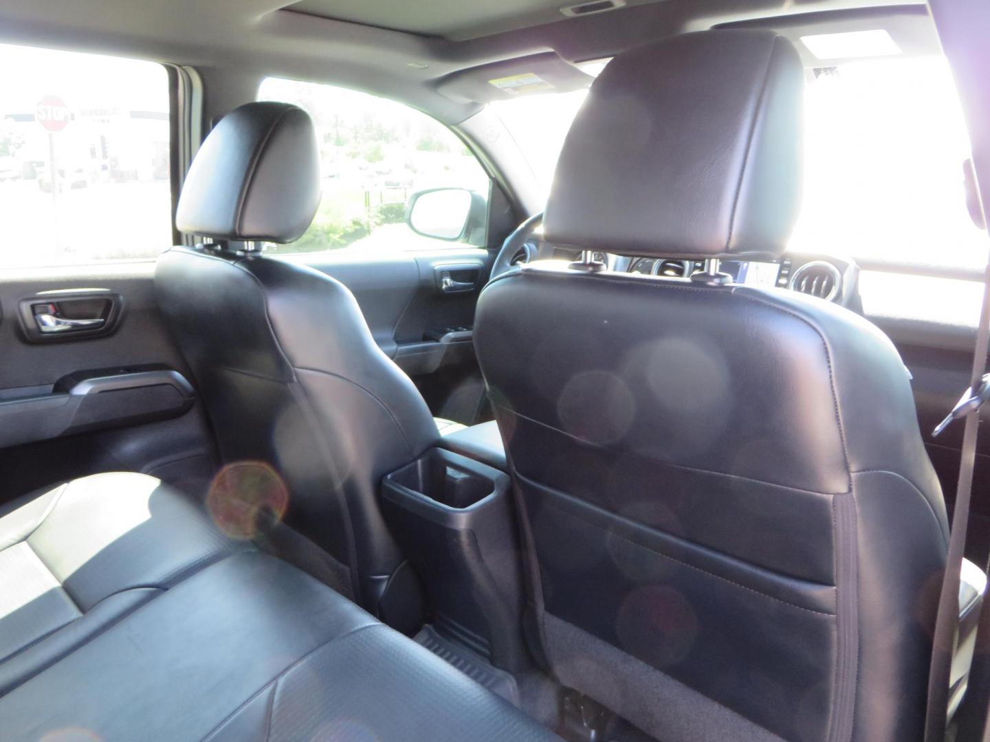 2021 White Toyota Tacoma SR5 Double Cab V6 6AT 4WD (3TYCZ5AN8MT) with an 3.5L V6 DOHC 24V engine, 6A transmission, located at 2630 Grass Valley Highway, Auburn, CA, 95603, (530) 508-5100, 38.937893, -121.095482 - Leveled Tacoma sitting on 18" Fuel wheels, Toyo RT tires, Bakflip bed cover, and window tint. - Photo#54