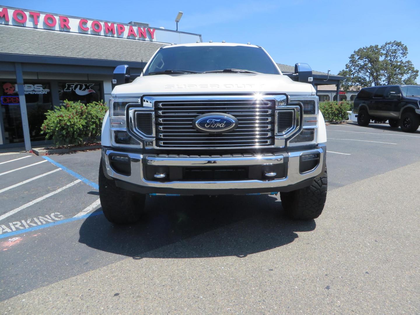 2021 White Ford F-450 SD King Ranch Crew Cab DRW 4WD (1FT8W4DT6ME) with an 6.7L V8 OHV 16V DIESEL engine, 6A transmission, located at 2630 Grass Valley Highway, Auburn, CA, 95603, (530) 508-5100, 38.937893, -121.095482 - Must see F450 King Ranch sitting on 37" Nitto Ridge Grappler tires wrapped around 22" American Force wheels, 2.5" King Remote reservoir Coilovers, King 2.5 adjustable shocks, King dual steering stabilizers, and window tint. - Photo#1