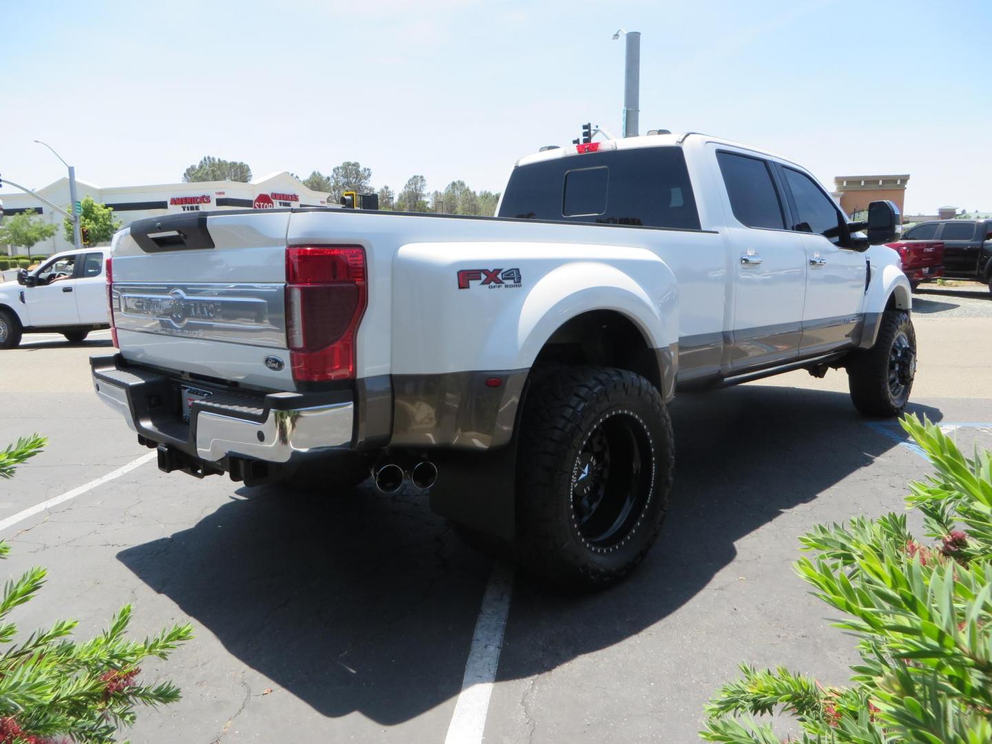 2021 White Ford F-450 SD King Ranch Crew Cab DRW 4WD (1FT8W4DT6ME) with an 6.7L V8 OHV 16V DIESEL engine, 6A transmission, located at 2630 Grass Valley Highway, Auburn, CA, 95603, (530) 508-5100, 38.937893, -121.095482 - Must see F450 King Ranch sitting on 37" Nitto Ridge Grappler tires wrapped around 22" American Force wheels, 2.5" King Remote reservoir Coilovers, King 2.5 adjustable shocks, King dual steering stabilizers, and window tint. - Photo#4