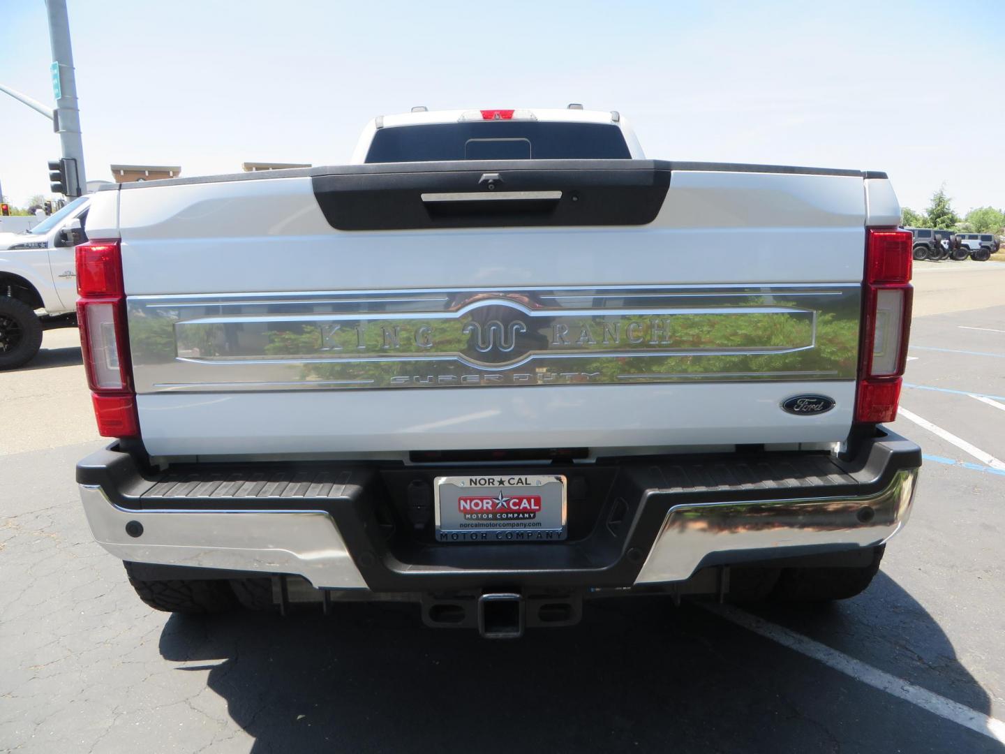 2021 White Ford F-450 SD King Ranch Crew Cab DRW 4WD (1FT8W4DT6ME) with an 6.7L V8 OHV 16V DIESEL engine, 6A transmission, located at 2630 Grass Valley Highway, Auburn, CA, 95603, (530) 508-5100, 38.937893, -121.095482 - Must see F450 King Ranch sitting on 37" Nitto Ridge Grappler tires wrapped around 22" American Force wheels, 2.5" King Remote reservoir Coilovers, King 2.5 adjustable shocks, King dual steering stabilizers, and window tint. - Photo#5