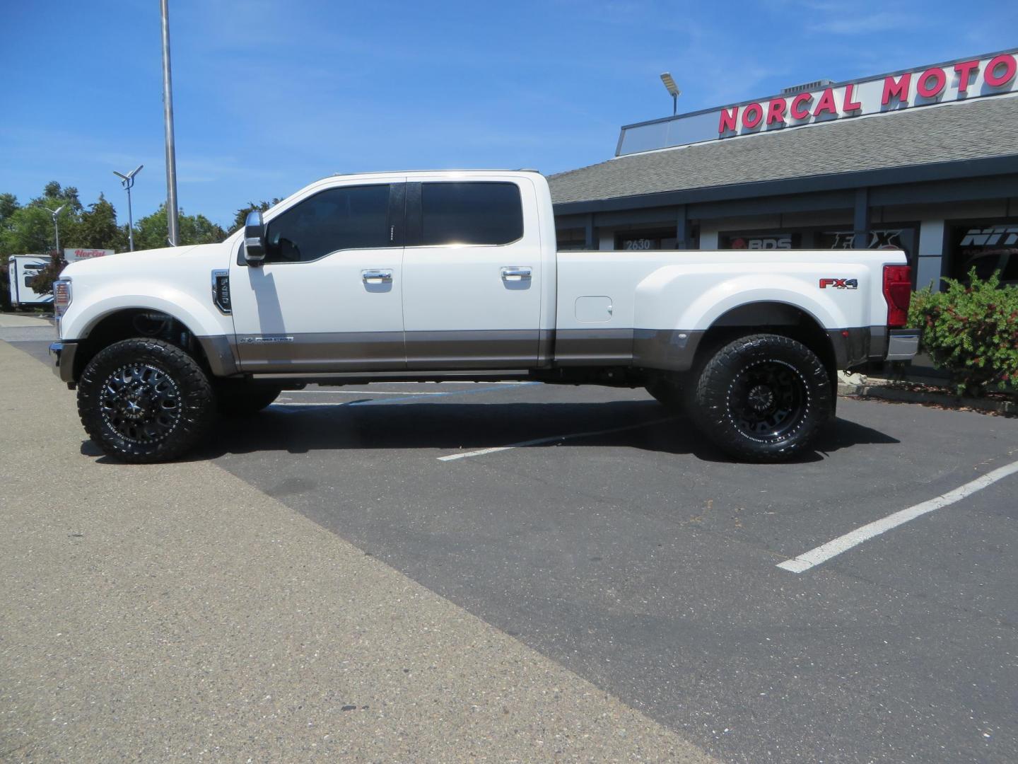 2021 White Ford F-450 SD King Ranch Crew Cab DRW 4WD (1FT8W4DT6ME) with an 6.7L V8 OHV 16V DIESEL engine, 6A transmission, located at 2630 Grass Valley Highway, Auburn, CA, 95603, (530) 508-5100, 38.937893, -121.095482 - Must see F450 King Ranch sitting on 37" Nitto Ridge Grappler tires wrapped around 22" American Force wheels, 2.5" King Remote reservoir Coilovers, King 2.5 adjustable shocks, King dual steering stabilizers, and window tint. - Photo#7