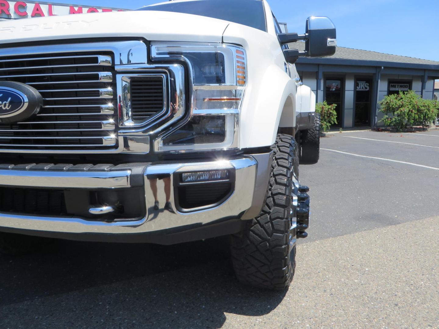 2021 White Ford F-450 SD King Ranch Crew Cab DRW 4WD (1FT8W4DT6ME) with an 6.7L V8 OHV 16V DIESEL engine, 6A transmission, located at 2630 Grass Valley Highway, Auburn, CA, 95603, (530) 508-5100, 38.937893, -121.095482 - Must see F450 King Ranch sitting on 37" Nitto Ridge Grappler tires wrapped around 22" American Force wheels, 2.5" King Remote reservoir Coilovers, King 2.5 adjustable shocks, King dual steering stabilizers, and window tint. - Photo#11