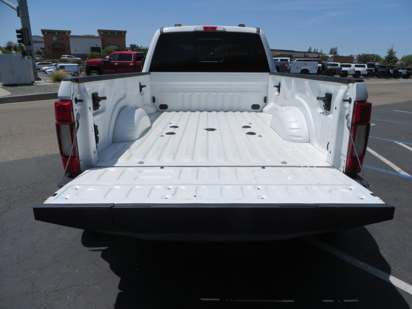 2021 White Ford F-450 SD King Ranch Crew Cab DRW 4WD (1FT8W4DT6ME) with an 6.7L V8 OHV 16V DIESEL engine, 6A transmission, located at 2630 Grass Valley Highway, Auburn, CA, 95603, (530) 508-5100, 38.937893, -121.095482 - Must see F450 King Ranch sitting on 37" Nitto Ridge Grappler tires wrapped around 22" American Force wheels, 2.5" King Remote reservoir Coilovers, King 2.5 adjustable shocks, King dual steering stabilizers, and window tint. - Photo#17