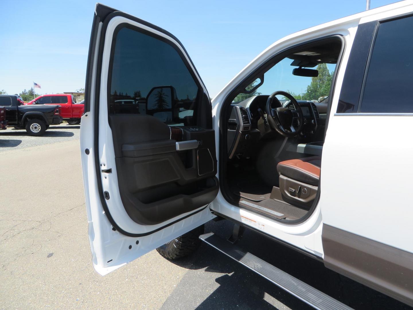 2021 White Ford F-450 SD King Ranch Crew Cab DRW 4WD (1FT8W4DT6ME) with an 6.7L V8 OHV 16V DIESEL engine, 6A transmission, located at 2630 Grass Valley Highway, Auburn, CA, 95603, (530) 508-5100, 38.937893, -121.095482 - Must see F450 King Ranch sitting on 37" Nitto Ridge Grappler tires wrapped around 22" American Force wheels, 2.5" King Remote reservoir Coilovers, King 2.5 adjustable shocks, King dual steering stabilizers, and window tint. - Photo#24