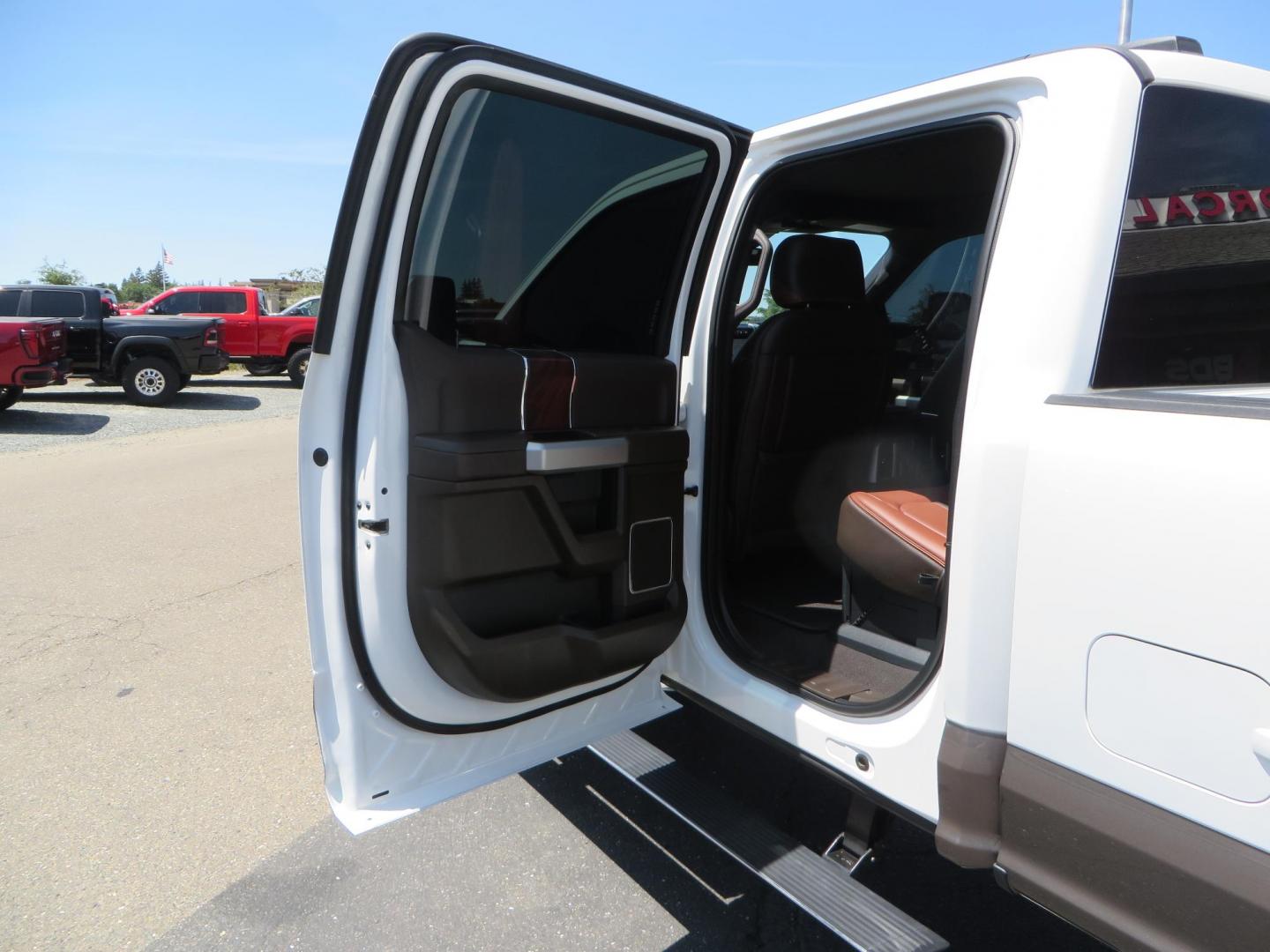 2021 White Ford F-450 SD King Ranch Crew Cab DRW 4WD (1FT8W4DT6ME) with an 6.7L V8 OHV 16V DIESEL engine, 6A transmission, located at 2630 Grass Valley Highway, Auburn, CA, 95603, (530) 508-5100, 38.937893, -121.095482 - Must see F450 King Ranch sitting on 37" Nitto Ridge Grappler tires wrapped around 22" American Force wheels, 2.5" King Remote reservoir Coilovers, King 2.5 adjustable shocks, King dual steering stabilizers, and window tint. - Photo#54