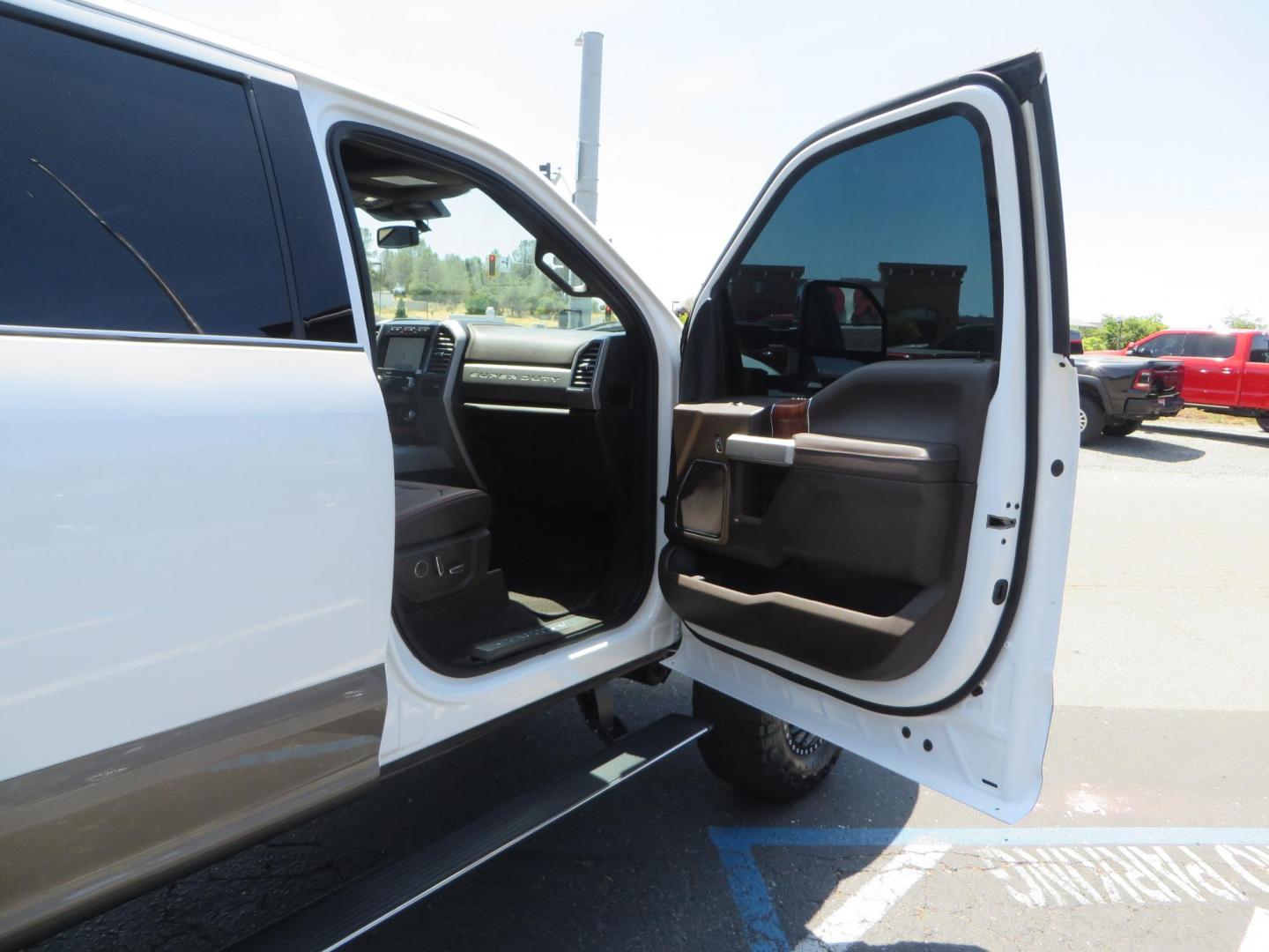2021 White Ford F-450 SD King Ranch Crew Cab DRW 4WD (1FT8W4DT6ME) with an 6.7L V8 OHV 16V DIESEL engine, 6A transmission, located at 2630 Grass Valley Highway, Auburn, CA, 95603, (530) 508-5100, 38.937893, -121.095482 - Must see F450 King Ranch sitting on 37" Nitto Ridge Grappler tires wrapped around 22" American Force wheels, 2.5" King Remote reservoir Coilovers, King 2.5 adjustable shocks, King dual steering stabilizers, and window tint. - Photo#61