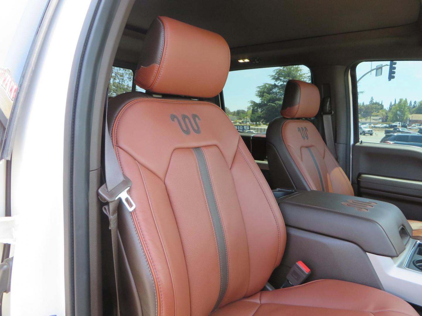 2021 White Ford F-450 SD King Ranch Crew Cab DRW 4WD (1FT8W4DT6ME) with an 6.7L V8 OHV 16V DIESEL engine, 6A transmission, located at 2630 Grass Valley Highway, Auburn, CA, 95603, (530) 508-5100, 38.937893, -121.095482 - Must see F450 King Ranch sitting on 37" Nitto Ridge Grappler tires wrapped around 22" American Force wheels, 2.5" King Remote reservoir Coilovers, King 2.5 adjustable shocks, King dual steering stabilizers, and window tint. - Photo#64