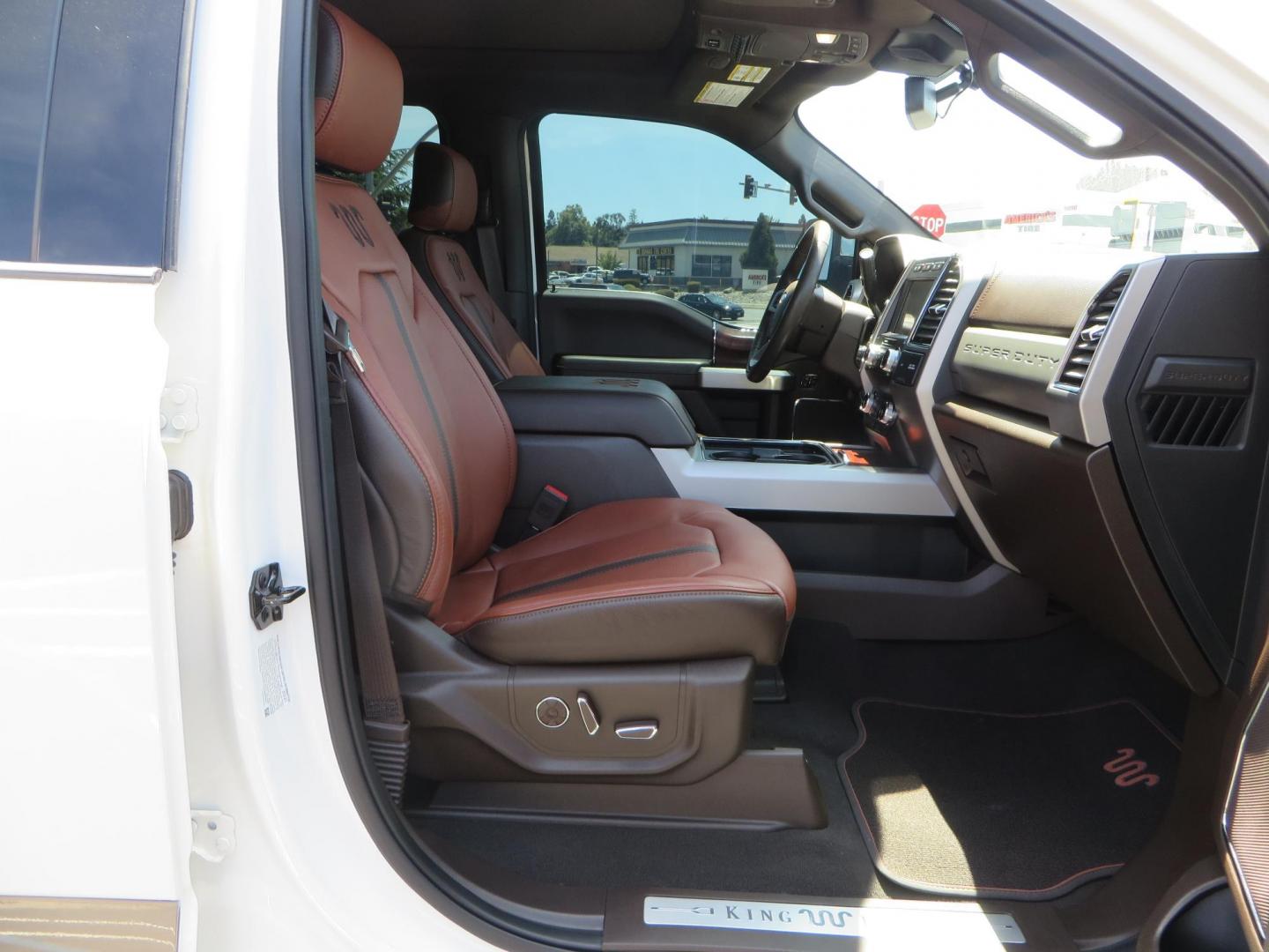 2021 White Ford F-450 SD King Ranch Crew Cab DRW 4WD (1FT8W4DT6ME) with an 6.7L V8 OHV 16V DIESEL engine, 6A transmission, located at 2630 Grass Valley Highway, Auburn, CA, 95603, (530) 508-5100, 38.937893, -121.095482 - Must see F450 King Ranch sitting on 37" Nitto Ridge Grappler tires wrapped around 22" American Force wheels, 2.5" King Remote reservoir Coilovers, King 2.5 adjustable shocks, King dual steering stabilizers, and window tint. - Photo#63