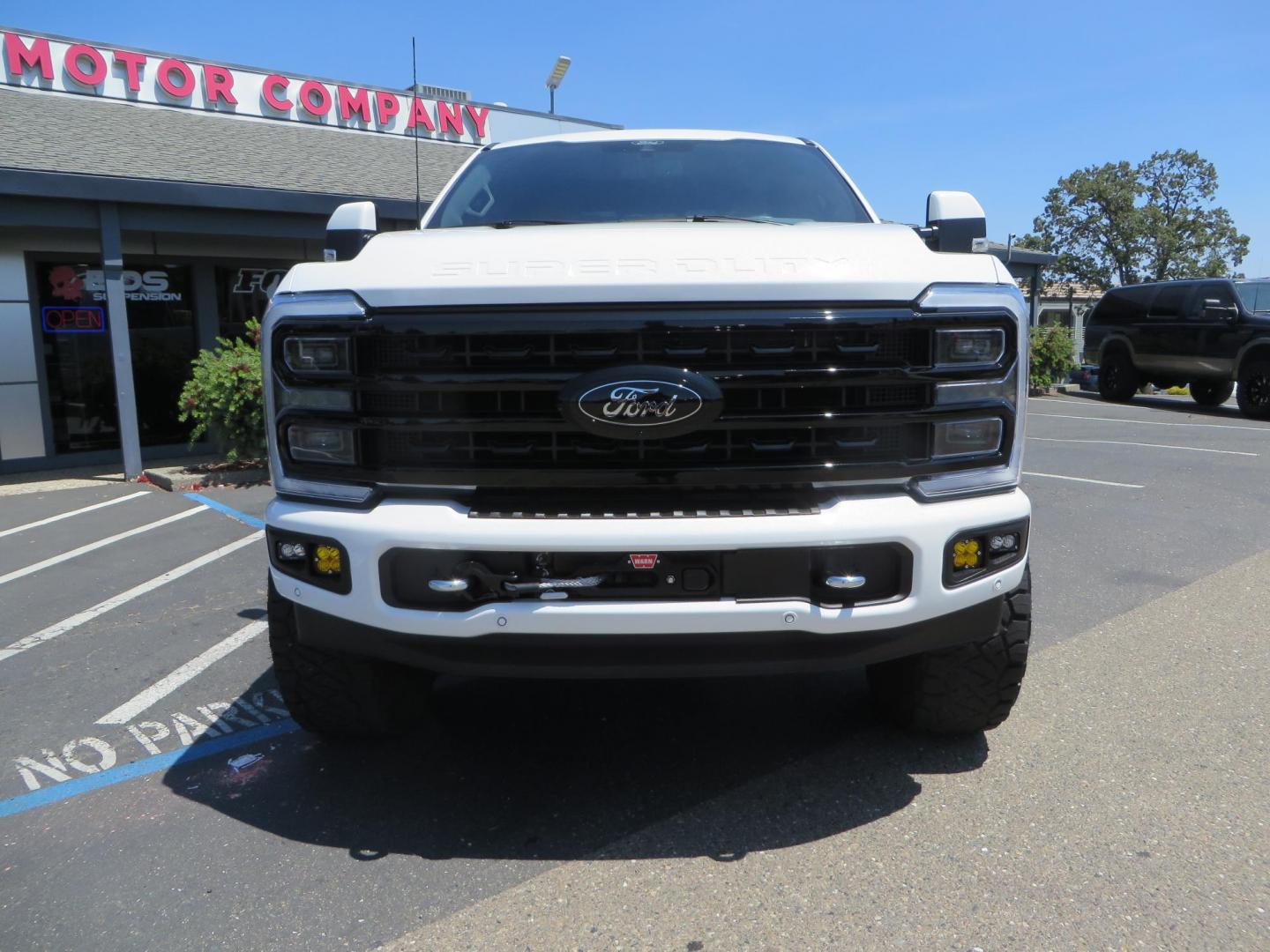 2024 White Ford F-250 SD Platinum Crew Cab 4WD (1FT8W2BM0RE) with an 6.7L V8 OHV 16V DIESEL engine, 6A transmission, located at 2630 Grass Valley Highway, Auburn, CA, 95603, (530) 508-5100, 38.937893, -121.095482 - Our Shop truck is ready for a new home. We installed a Carli 3.5" E-Venture suspension system, Torsion Sway Bar, Full Progressive Spring pack, Leaf Spring Shackles, Adjustable Radius Arms, High & Low Mount Steering Stabilizers, Long Travel Air Bags, Logiq HD2 Air compressor, Logiq Air Tank with chuc - Photo#1