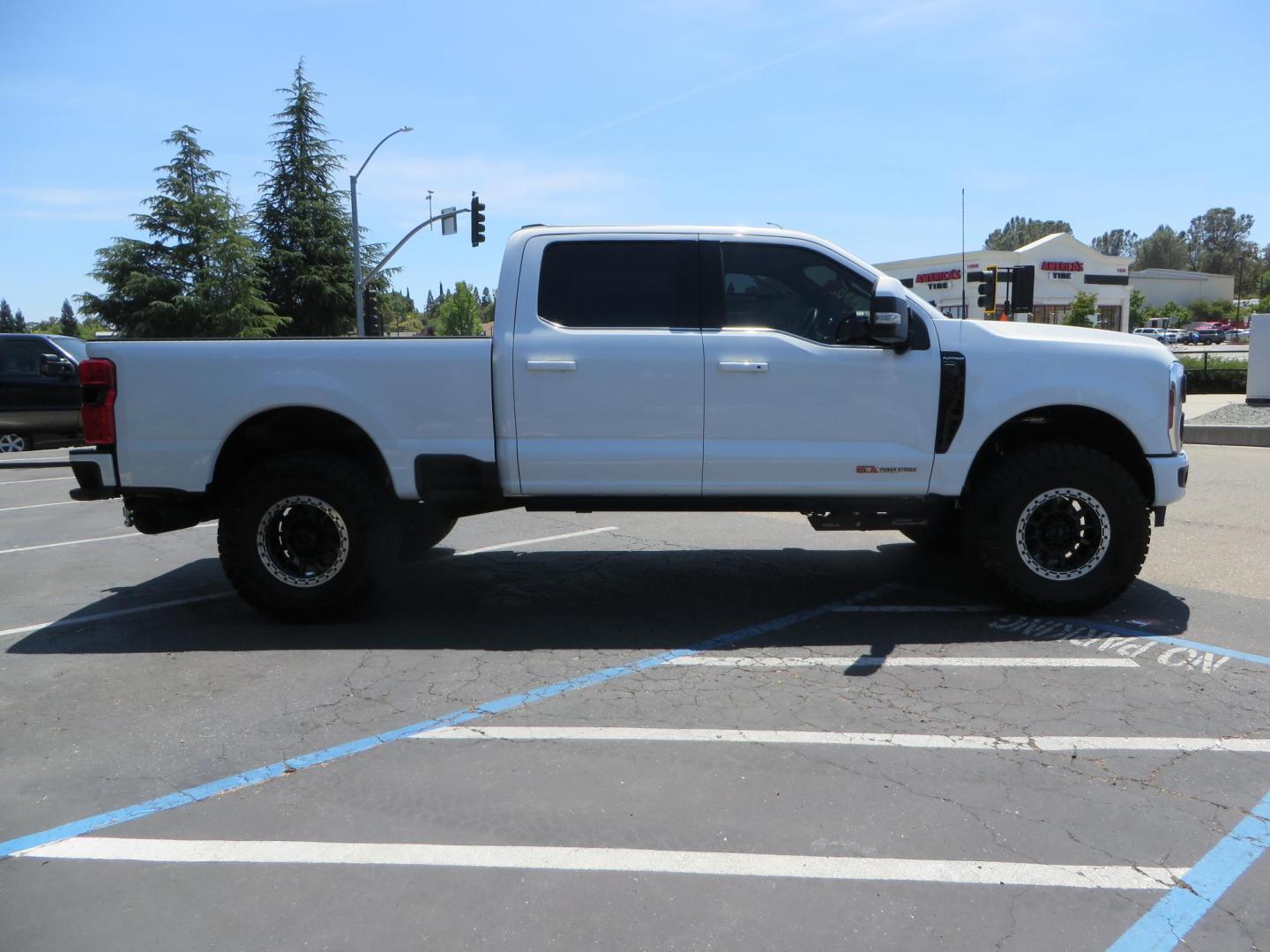 2024 White Ford F-250 SD Platinum Crew Cab 4WD (1FT8W2BM0RE) with an 6.7L V8 OHV 16V DIESEL engine, 6A transmission, located at 2630 Grass Valley Highway, Auburn, CA, 95603, (530) 508-5100, 38.937893, -121.095482 - Our Shop truck is ready for a new home. We installed a Carli 3.5" E-Venture suspension system, Torsion Sway Bar, Full Progressive Spring pack, Leaf Spring Shackles, Adjustable Radius Arms, High & Low Mount Steering Stabilizers, Long Travel Air Bags, Logiq HD2 Air compressor, Logiq Air Tank with chuc - Photo#3