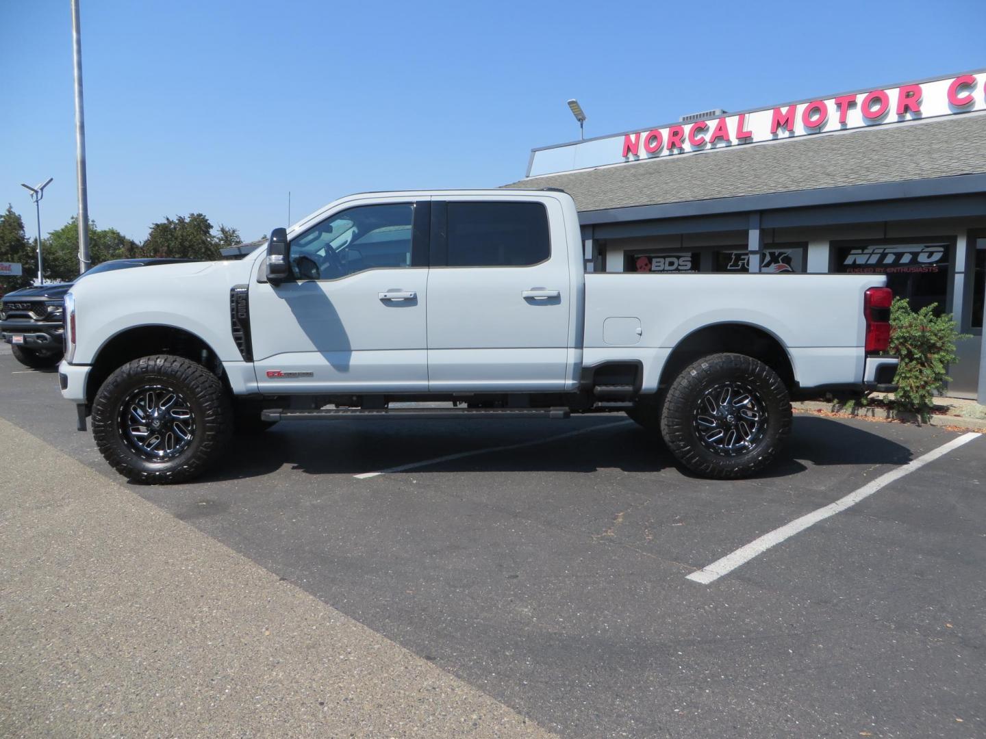 2025 Gray /Black Ford F-350 SD Lariat Crew Cab Short Bed 4WD (1FT8W3BM5SE) with an 6.7L V8 OHV 16V DIESEL engine, 6A transmission, located at 2630 Grass Valley Highway, Auburn, CA, 95603, (530) 508-5100, 38.937893, -121.095482 - Features a Readylift level kit, Falcon shocks, 20" Fuel Triton wheels, and 37" Nitto Ridge Grappler tires. - Photo#1