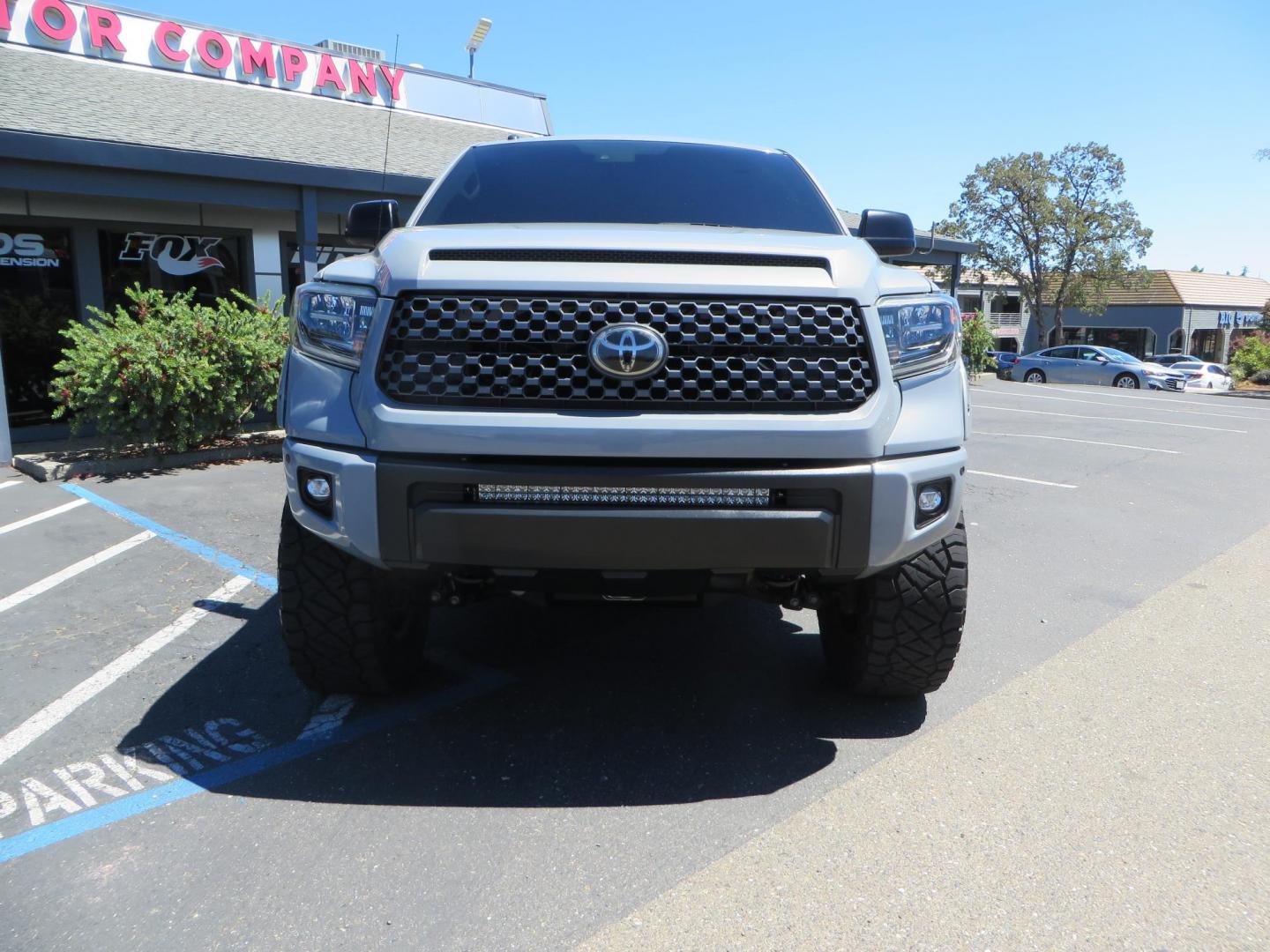 2018 Gray /Black Toyota Tundra SR5 5.7L V8 CrewMax 4WD (5TFDY5F15JX) with an 5.7L V8 DOHC 32V engine, 6A transmission, located at 2630 Grass Valley Highway, Auburn, CA, 95603, (530) 508-5100, 38.937893, -121.095482 - Lifted Tundra sitting on a Pro Comp 6" Lift kit, 37" Nitto Ridge Grappler tires, 20" Fuel Recoil wheels, N-Fab running boards, Grille Mounted Light Bar, Bilstein 5100 rear shocks, TRD dual exhaust, Fender Flarew, and window tint. - Photo#7