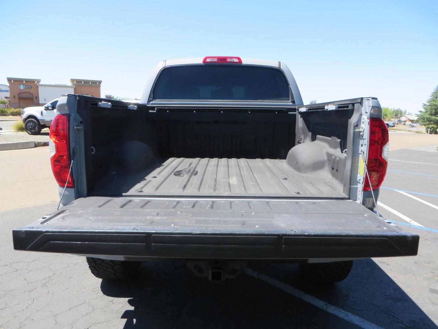 2018 Gray /Black Toyota Tundra SR5 5.7L V8 CrewMax 4WD (5TFDY5F15JX) with an 5.7L V8 DOHC 32V engine, 6A transmission, located at 2630 Grass Valley Highway, Auburn, CA, 95603, (530) 508-5100, 38.937893, -121.095482 - Lifted Tundra sitting on a Pro Comp 6" Lift kit, 37" Nitto Ridge Grappler tires, 20" Fuel Recoil wheels, N-Fab running boards, Grille Mounted Light Bar, Bilstein 5100 rear shocks, TRD dual exhaust, Fender Flarew, and window tint. - Photo#14