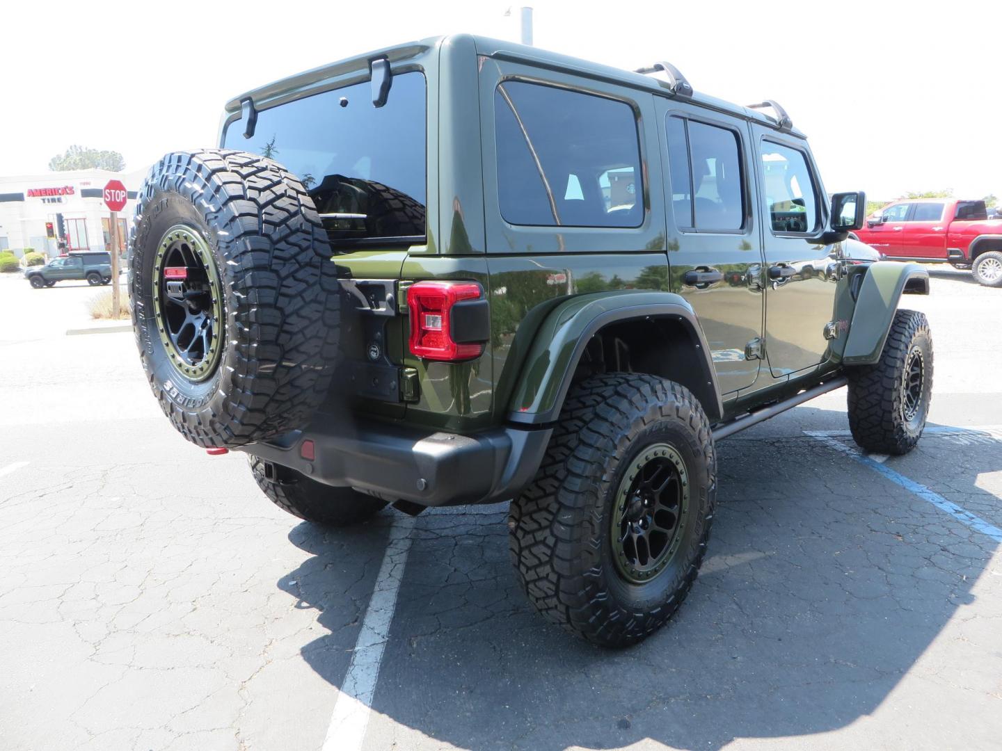 2021 Green Jeep Wrangler Unlimited Rubicon (1C4JJXFM1MW) with an 3.0L V6 DOHC 24V TURBO DIESEL engine, 6A transmission, located at 2630 Grass Valley Highway, Auburn, CA, 95603, (530) 508-5100, 38.937893, -121.095482 - Mopar lifted Diesel Rubicon with Fox shocks, HD tire carrier, Amp Power steps, Roof Rack, and color matched simulated beadlock rings. - Photo#4