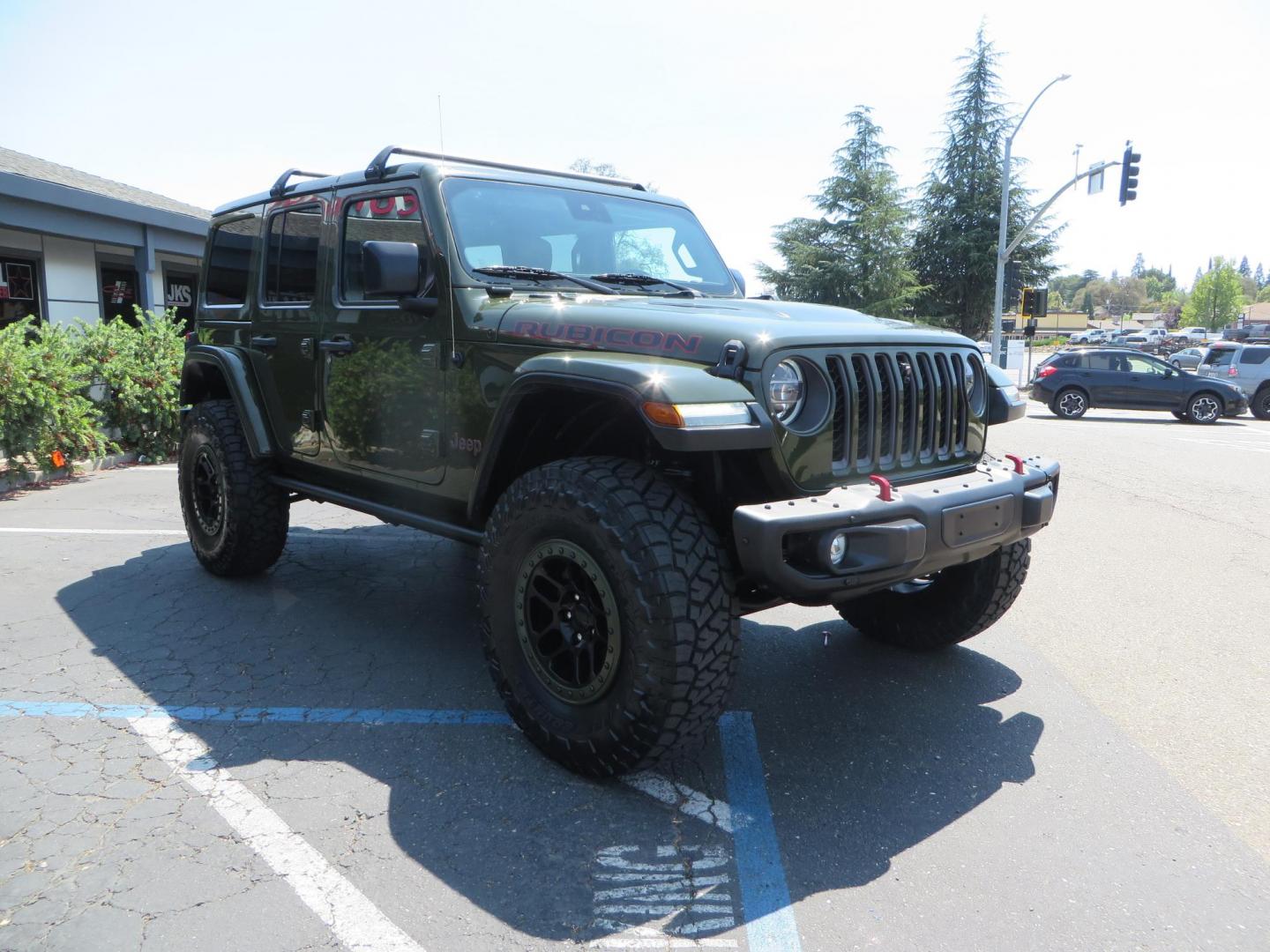2021 Green Jeep Wrangler Unlimited Rubicon (1C4JJXFM1MW) with an 3.0L V6 DOHC 24V TURBO DIESEL engine, 6A transmission, located at 2630 Grass Valley Highway, Auburn, CA, 95603, (530) 508-5100, 38.937893, -121.095482 - Mopar lifted Diesel Rubicon with Fox shocks, HD tire carrier, Amp Power steps, Roof Rack, and color matched simulated beadlock rings. - Photo#6