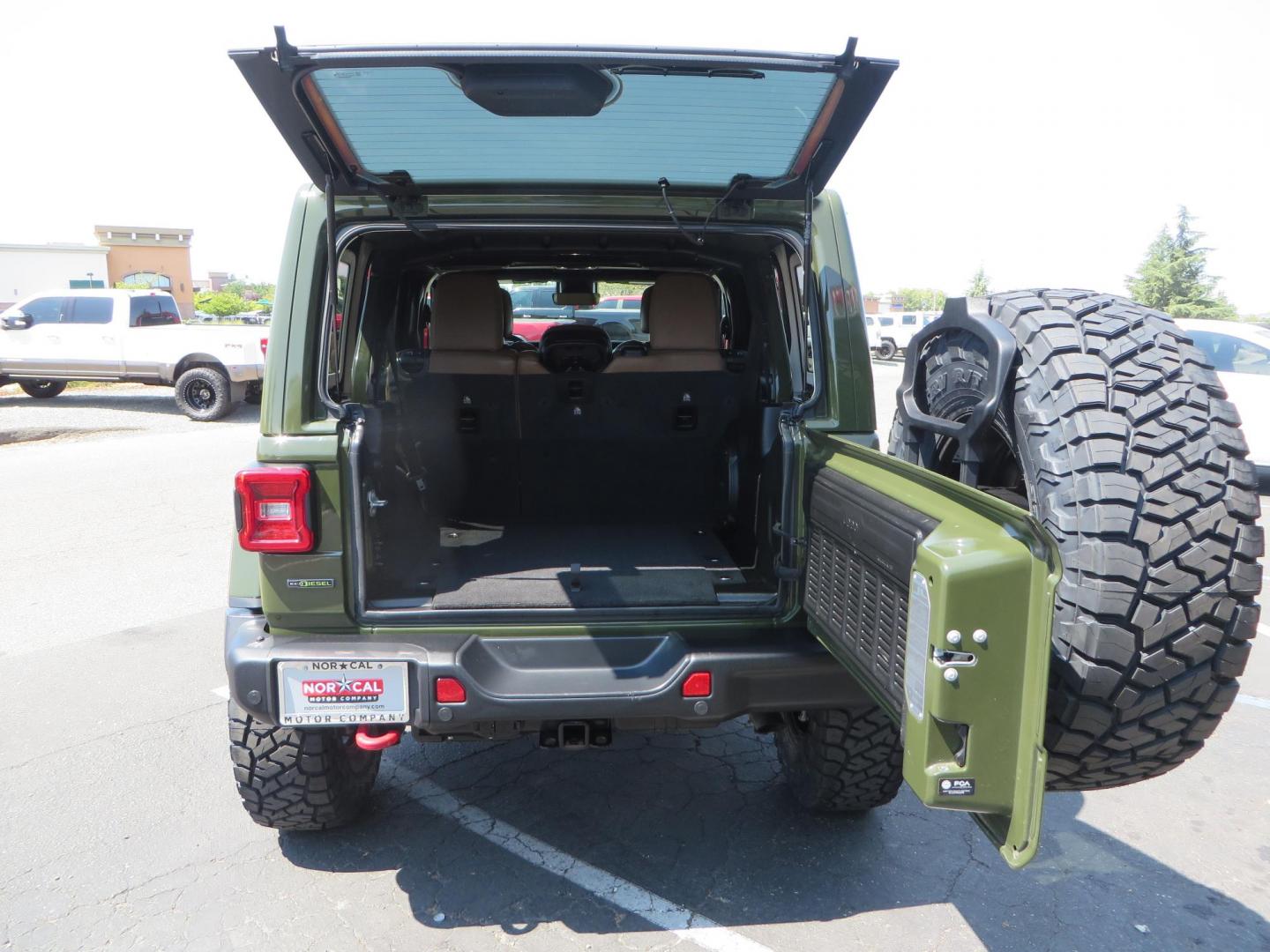 2021 Green Jeep Wrangler Unlimited Rubicon (1C4JJXFM1MW) with an 3.0L V6 DOHC 24V TURBO DIESEL engine, 6A transmission, located at 2630 Grass Valley Highway, Auburn, CA, 95603, (530) 508-5100, 38.937893, -121.095482 - Mopar lifted Diesel Rubicon with Fox shocks, HD tire carrier, Amp Power steps, Roof Rack, and color matched simulated beadlock rings. - Photo#64