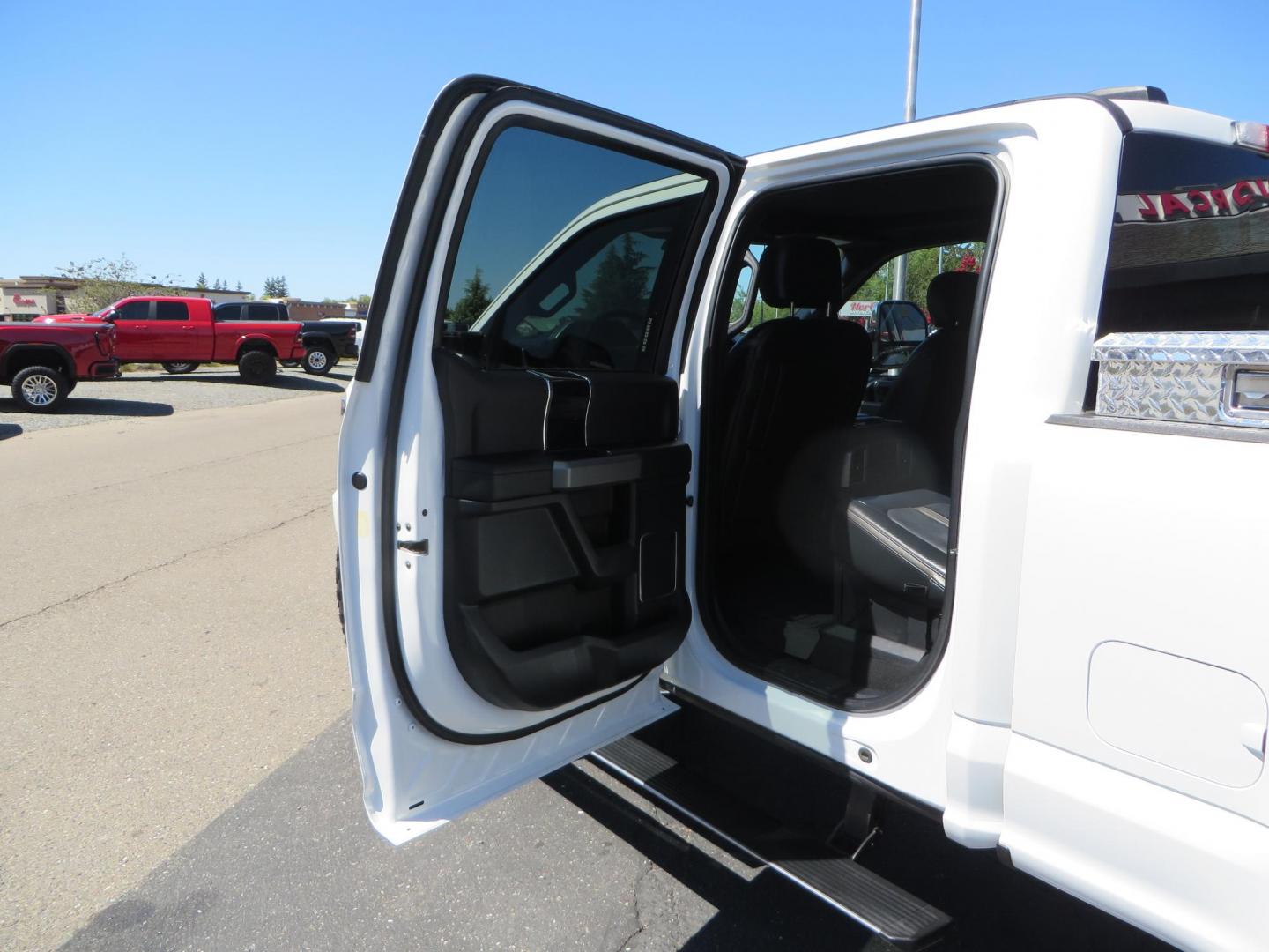 2022 White /BLACK Ford F-350 SD Platinum Crew Cab 4WD (1FT8W3BT2NE) with an 6.7L V8 OHV 16V DIESEL engine, 6A transmission, located at 2630 Grass Valley Highway, Auburn, CA, 95603, (530) 508-5100, 38.937893, -121.095482 - Features a BDS 2" level kit, Fox shocks, 18" Method MR323 wheels, 37" Toyo RT Pro tires, UWS tool box, folding bedcover. - Photo#49