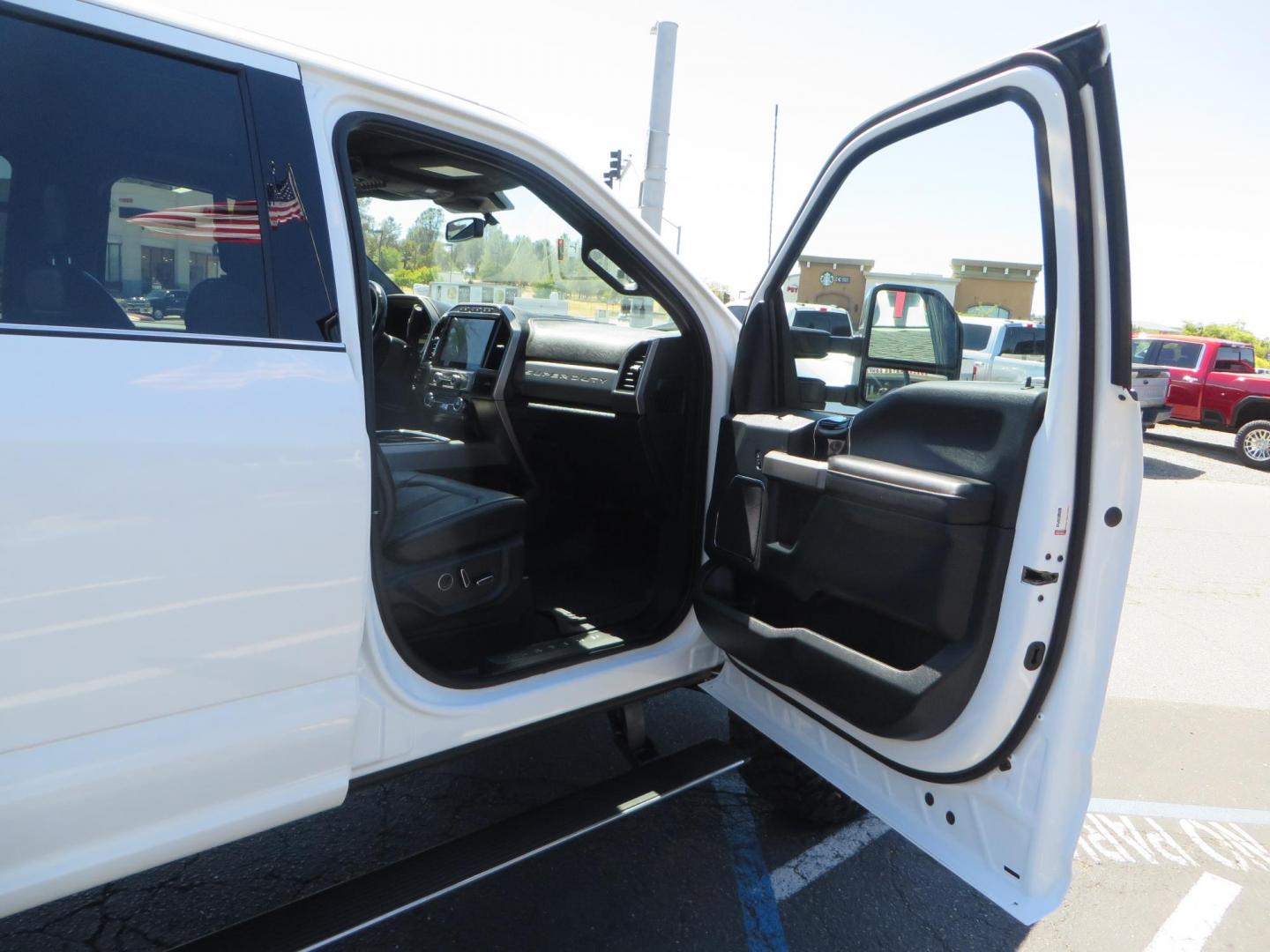 2022 White /BLACK Ford F-350 SD Platinum Crew Cab 4WD (1FT8W3BT2NE) with an 6.7L V8 OHV 16V DIESEL engine, 6A transmission, located at 2630 Grass Valley Highway, Auburn, CA, 95603, (530) 508-5100, 38.937893, -121.095482 - Features a BDS 2" level kit, Fox shocks, 18" Method MR323 wheels, 37" Toyo RT Pro tires, UWS tool box, folding bedcover. - Photo#58