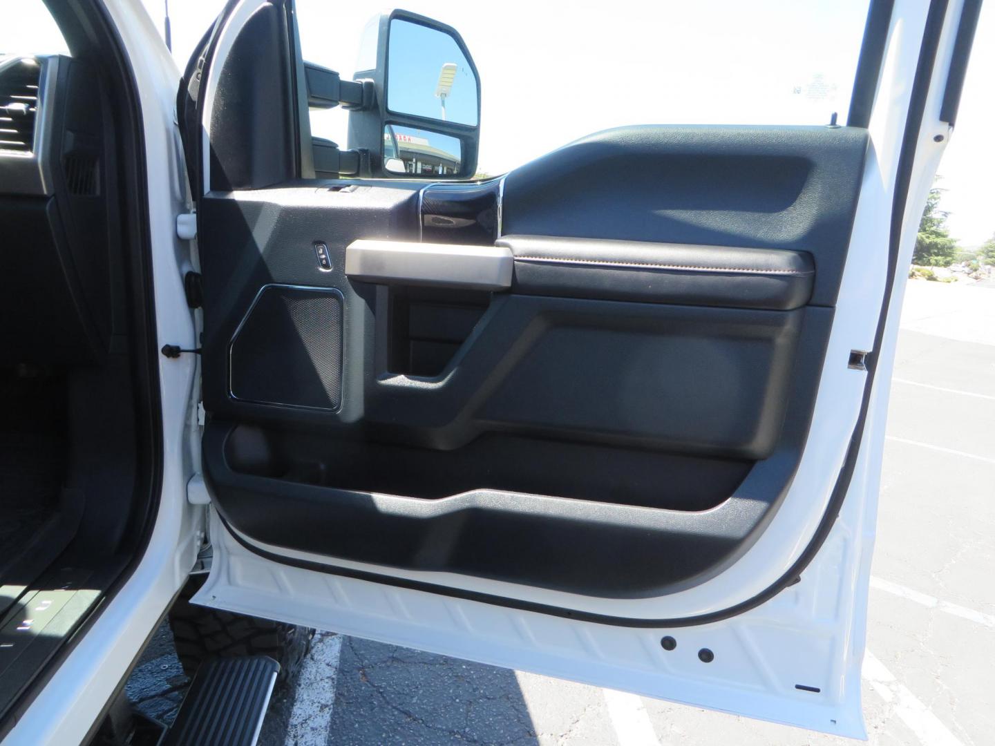 2022 White /BLACK Ford F-350 SD Platinum Crew Cab 4WD (1FT8W3BT2NE) with an 6.7L V8 OHV 16V DIESEL engine, 6A transmission, located at 2630 Grass Valley Highway, Auburn, CA, 95603, (530) 508-5100, 38.937893, -121.095482 - Features a BDS 2" level kit, Fox shocks, 18" Method MR323 wheels, 37" Toyo RT Pro tires, UWS tool box, folding bedcover. - Photo#59