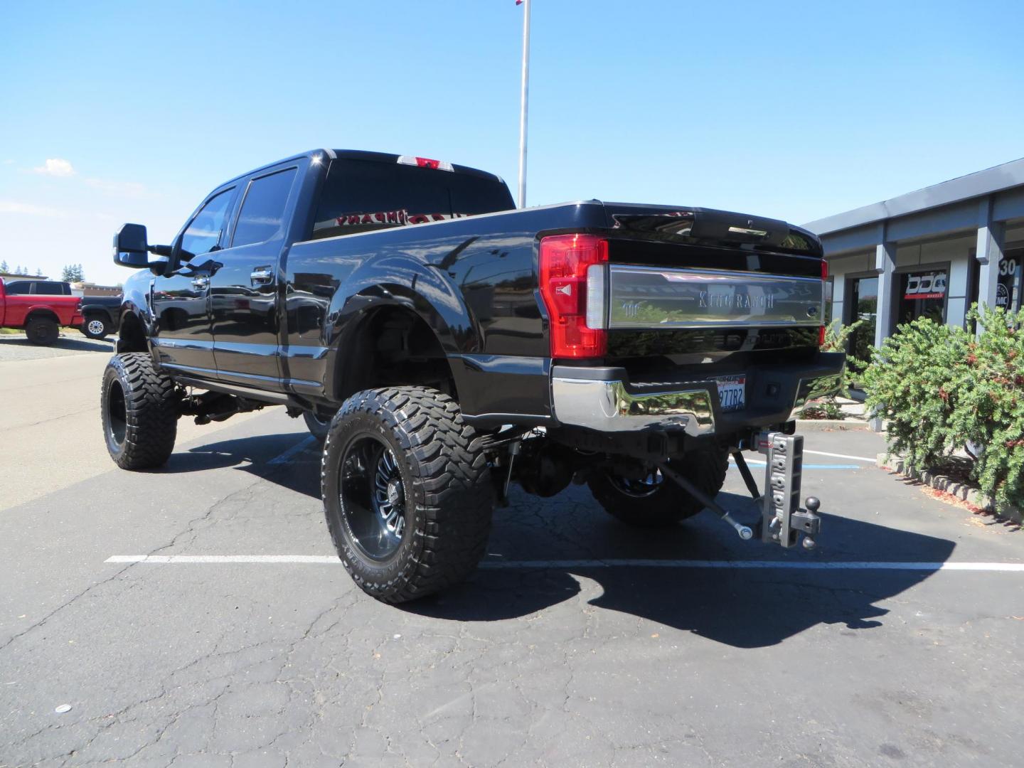 2017 BLACK /Brown Ford F-250 SD King Ranch Crew Cab 4WD (1FT7W2BT5HE) with an 6.7L V8 OHV 16V DIESEL engine, 6A transmission, located at 2630 Grass Valley Highway, Auburn, CA, 95603, (530) 508-5100, 38.937893, -121.095482 - Monster Superduty sitting on an 8" BDS long arm Fox 2.5 Coilover suspension system, Fox 2.0 shocks, Fox dual steering stabilizers, 22" Specialty Forged wheels, 40" Toyo MT tires, Undercover Ultraflex tonneau cover, 15" Drop Gen-Y hitch, and window tint. - Photo#2