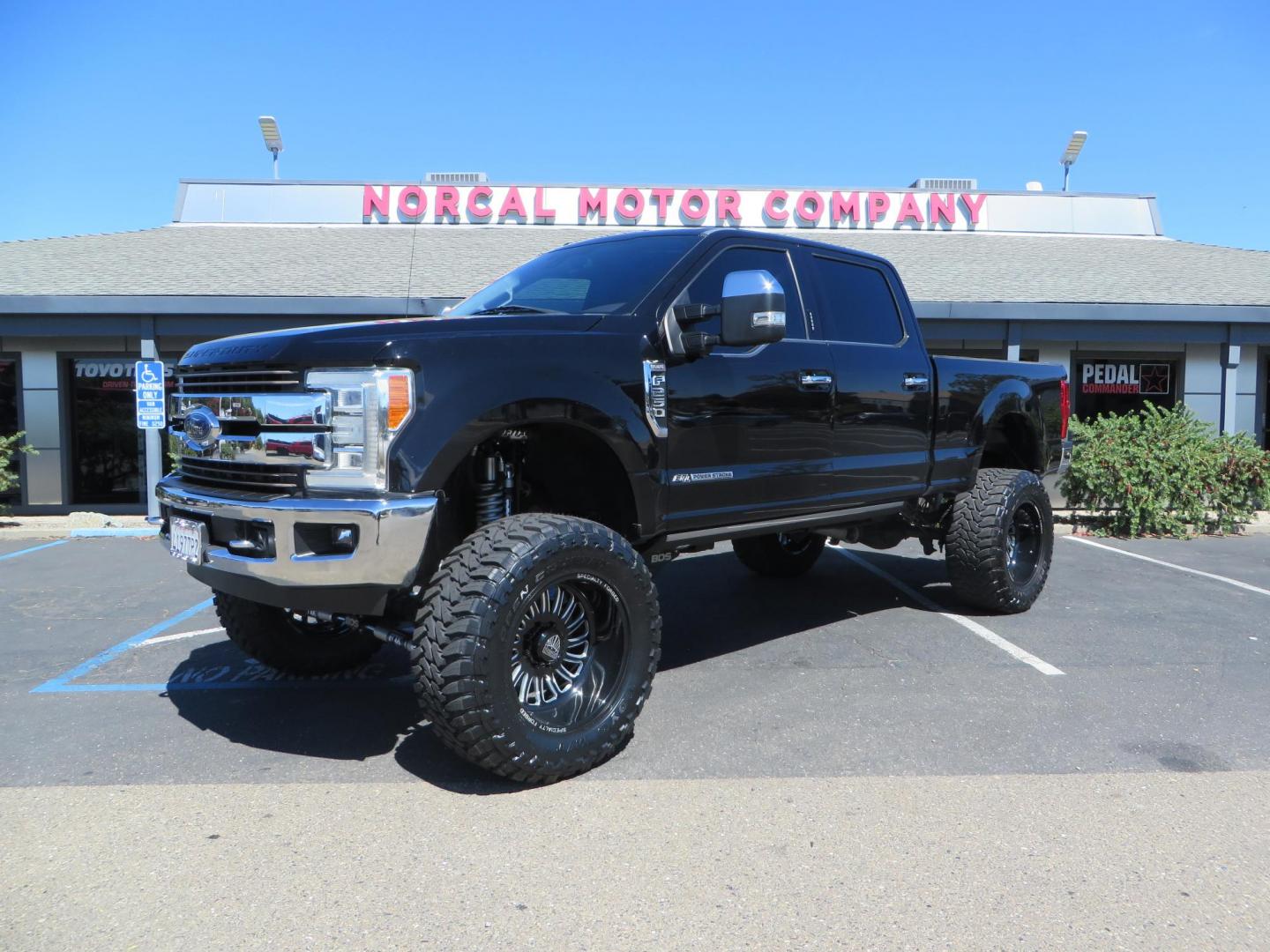2017 BLACK /Brown Ford F-250 SD King Ranch Crew Cab 4WD (1FT7W2BT5HE) with an 6.7L V8 OHV 16V DIESEL engine, 6A transmission, located at 2630 Grass Valley Highway, Auburn, CA, 95603, (530) 508-5100, 38.937893, -121.095482 - Monster Superduty sitting on an 8" BDS long arm Fox 2.5 Coilover suspension system, Fox 2.0 shocks, Fox dual steering stabilizers, 22" Specialty Forged wheels, 40" Toyo MT tires, Undercover Ultraflex tonneau cover, 15" Drop Gen-Y hitch, and window tint. - Photo#0