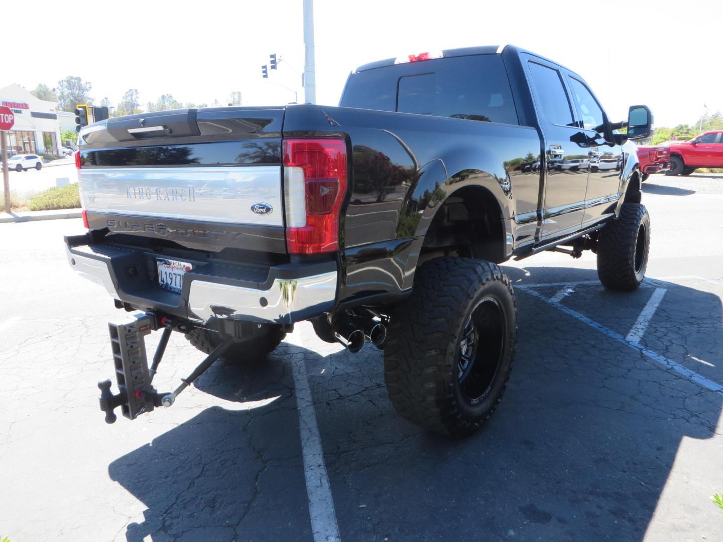 2017 BLACK /Brown Ford F-250 SD King Ranch Crew Cab 4WD (1FT7W2BT5HE) with an 6.7L V8 OHV 16V DIESEL engine, 6A transmission, located at 2630 Grass Valley Highway, Auburn, CA, 95603, (530) 508-5100, 38.937893, -121.095482 - Monster Superduty sitting on an 8" BDS long arm Fox 2.5 Coilover suspension system, Fox 2.0 shocks, Fox dual steering stabilizers, 22" Specialty Forged wheels, 40" Toyo MT tires, Undercover Ultraflex tonneau cover, 15" Drop Gen-Y hitch, and window tint. - Photo#4