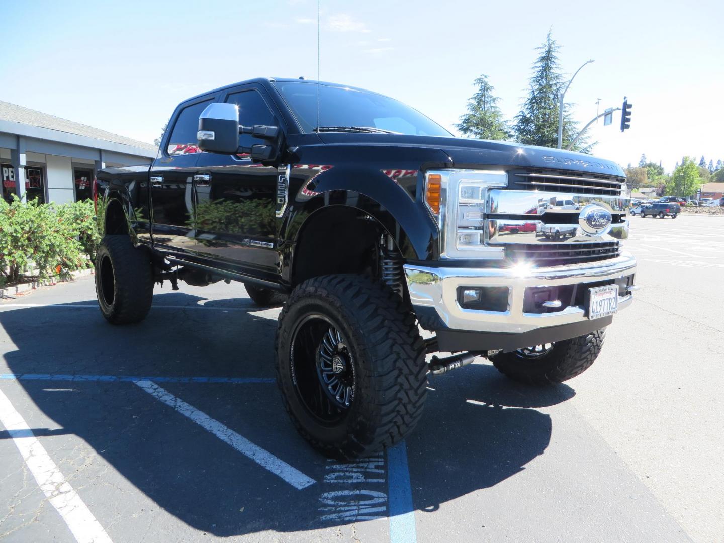 2017 BLACK /Brown Ford F-250 SD King Ranch Crew Cab 4WD (1FT7W2BT5HE) with an 6.7L V8 OHV 16V DIESEL engine, 6A transmission, located at 2630 Grass Valley Highway, Auburn, CA, 95603, (530) 508-5100, 38.937893, -121.095482 - Monster Superduty sitting on an 8" BDS long arm Fox 2.5 Coilover suspension system, Fox 2.0 shocks, Fox dual steering stabilizers, 22" Specialty Forged wheels, 40" Toyo MT tires, Undercover Ultraflex tonneau cover, 15" Drop Gen-Y hitch, and window tint. - Photo#6