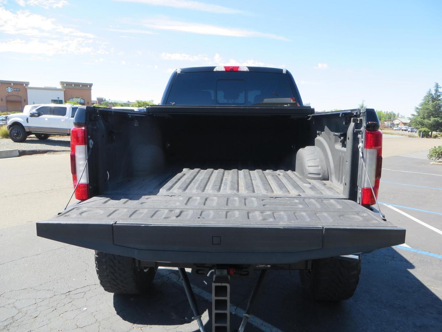 2017 BLACK /Brown Ford F-250 SD King Ranch Crew Cab 4WD (1FT7W2BT5HE) with an 6.7L V8 OHV 16V DIESEL engine, 6A transmission, located at 2630 Grass Valley Highway, Auburn, CA, 95603, (530) 508-5100, 38.937893, -121.095482 - Monster Superduty sitting on an 8" BDS long arm Fox 2.5 Coilover suspension system, Fox 2.0 shocks, Fox dual steering stabilizers, 22" Specialty Forged wheels, 40" Toyo MT tires, Undercover Ultraflex tonneau cover, 15" Drop Gen-Y hitch, and window tint. - Photo#14