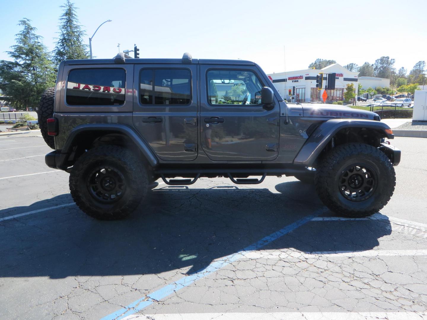 2020 Gray Jeep Wrangler Unlimited Rubicon (1C4HJXFN0LW) with an 2.0L L4 DOHC 16V TURBO engine, 6A transmission, located at 2630 Grass Valley Highway, Auburn, CA, 95603, (530) 508-5100, 38.937893, -121.095482 - Features a 3" Zone offroad suspension system, Fox Adventure series shocks, 37" Toyo RT tires, 17" Double Black Method NV wheels, Teraflex HD spare tire carrier, Nerf steps, and roof rack crossbars. - Photo#5