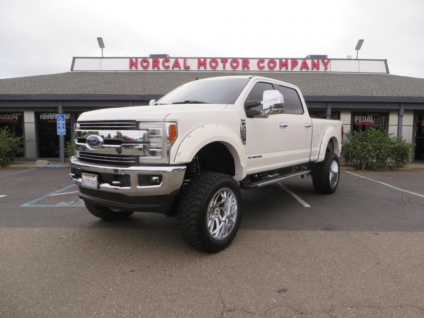 2019 White /Black Ford F-250 SD Lariat Crew Cab Short Bed 4WD (1FT7W2BT2KE) with an 6.7L V8 OHV 16V DIESEL engine, 6A transmission, located at 2630 Grass Valley Highway, Auburn, CA, 95603, (530) 508-5100, 38.937893, -121.095482 - Features a Fabtech 6" 4 link Lift kit, Fox remote reservoir shocks, 37" RBP MT tires, 22" Hostile wheels, Bushwacker Fender flares, Undercover Ultraflex bedcover, and window tint. - Photo#0
