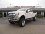 2019 White /Black Ford F-250 SD Lariat Crew Cab Short Bed 4WD (1FT7W2BT2KE) with an 6.7L V8 OHV 16V DIESEL engine, 6A transmission, located at 2630 Grass Valley Highway, Auburn, CA, 95603, (530) 508-5100, 38.937893, -121.095482 - Features a Fabtech 6" 4 link Lift kit, Fox remote reservoir shocks, 37" RBP MT tires, 22" Hostile wheels, Bushwacker Fender flares, Undercover Ultraflex bedcover, and window tint. - Photo#0