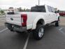 2019 White /Black Ford F-250 SD Lariat Crew Cab Short Bed 4WD (1FT7W2BT2KE) with an 6.7L V8 OHV 16V DIESEL engine, 6A transmission, located at 2630 Grass Valley Highway, Auburn, CA, 95603, (530) 508-5100, 38.937893, -121.095482 - Features a Fabtech 6" 4 link Lift kit, Fox remote reservoir shocks, 37" RBP MT tires, 22" Hostile wheels, Bushwacker Fender flares, Undercover Ultraflex bedcover, and window tint. - Photo#4