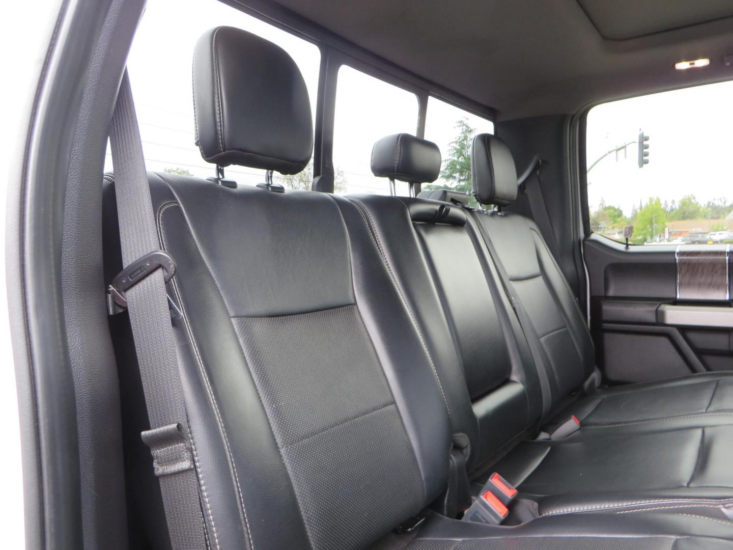 2019 White /Black Ford F-250 SD Lariat Crew Cab Short Bed 4WD (1FT7W2BT2KE) with an 6.7L V8 OHV 16V DIESEL engine, 6A transmission, located at 2630 Grass Valley Highway, Auburn, CA, 95603, (530) 508-5100, 38.937893, -121.095482 - Features a Fabtech 6" 4 link Lift kit, Fox remote reservoir shocks, 37" RBP MT tires, 22" Hostile wheels, Bushwacker Fender flares, Undercover Ultraflex bedcover, and window tint. - Photo#71