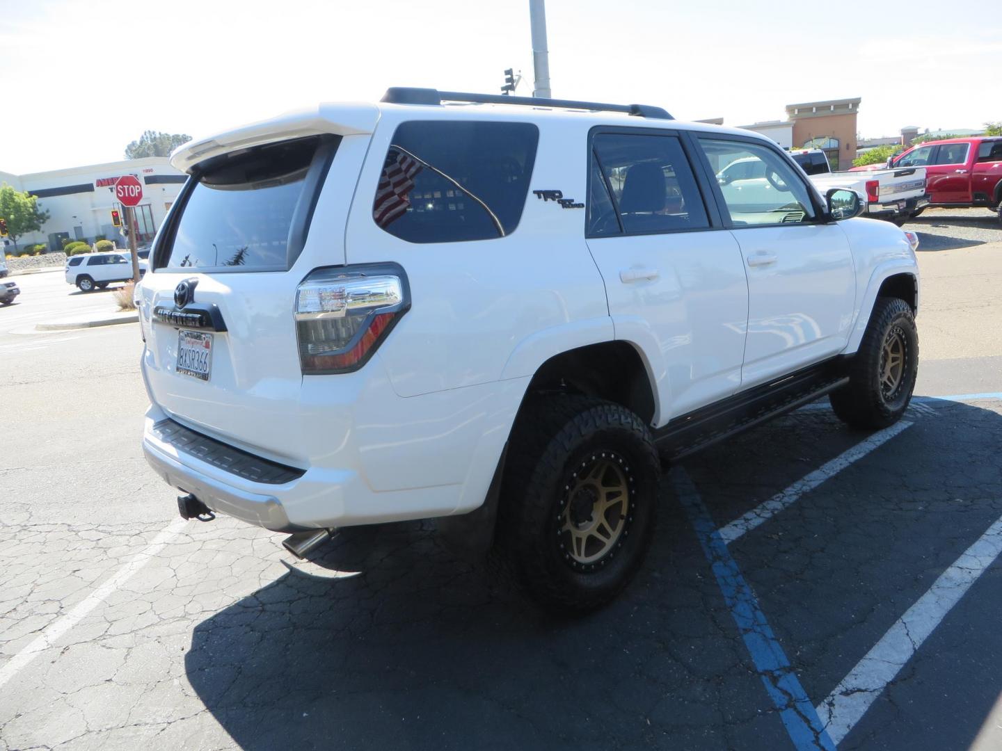2021 White Toyota 4Runner TRD Off-road Premium 4WD (JTERU5JR5M5) with an 4.0L V6 DOHC 24V engine, 5A transmission, located at 2630 Grass Valley Highway, Auburn, CA, 95603, (530) 508-5100, 38.937893, -121.095482 - TRD Offroad Premium 4Runner ready for all of your adventures. Features Ironman suspension, 285 Falken Wildpeak AT3W tires, 17" Method Race wheels, Front winch bumper, Badlands winch, Led bumper and ditch lights, and rear cargo molle panels. - Photo#4